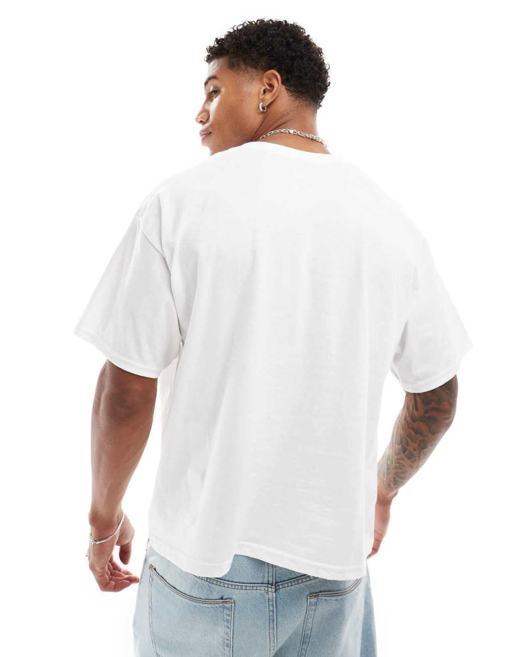 ASOS DESIGN boxy oversized t-shirt with sports graphic in white Product Image
