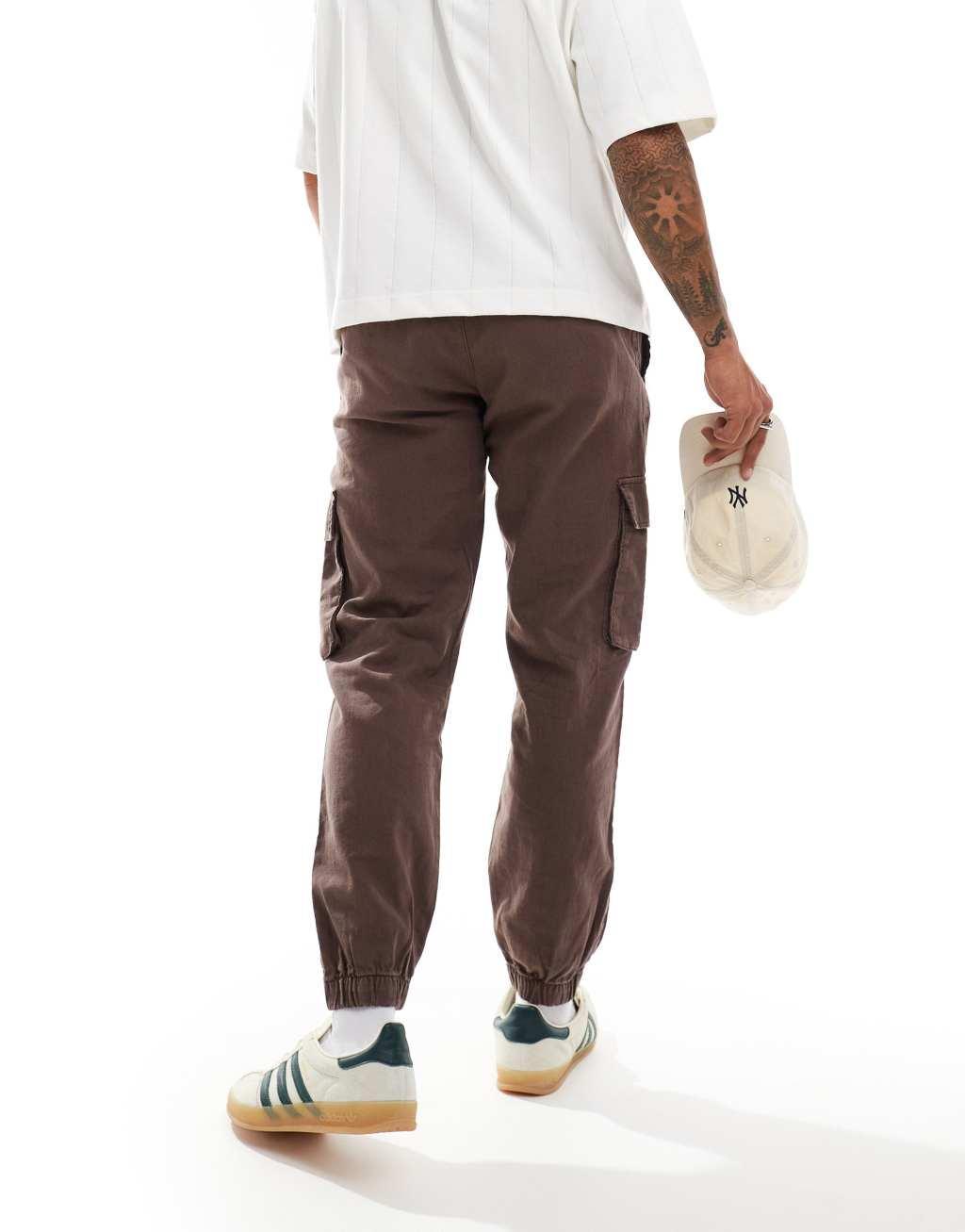 ASOS DESIGN tapered pull on linen mix cargo pants in washed brown Product Image