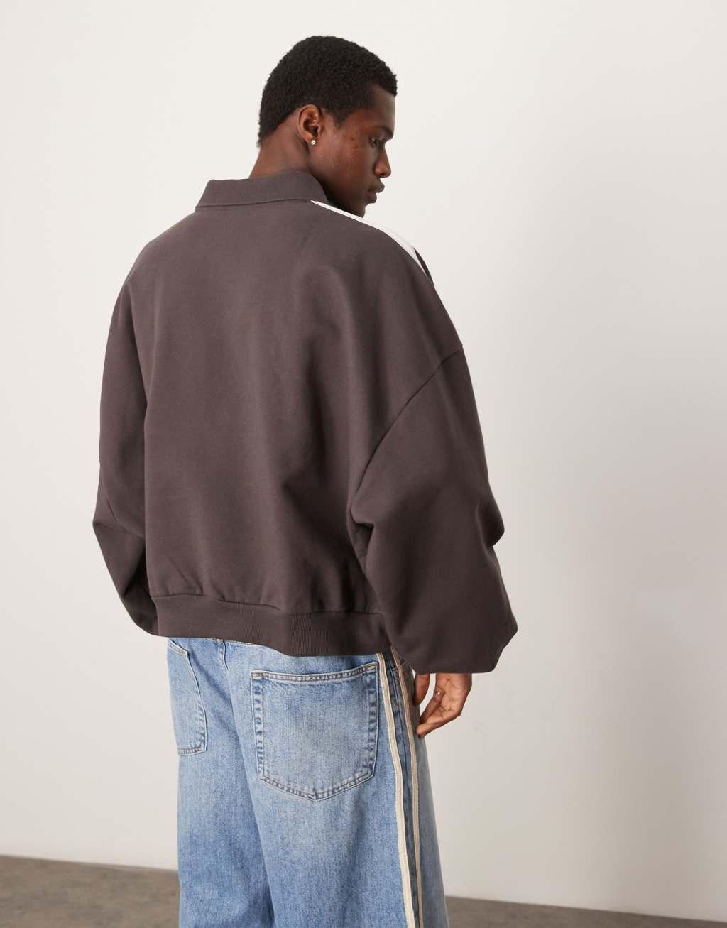 ASOS DESIGN heavyweight extreme oversized rugby sweatshirt with taping detail in dark brown Product Image