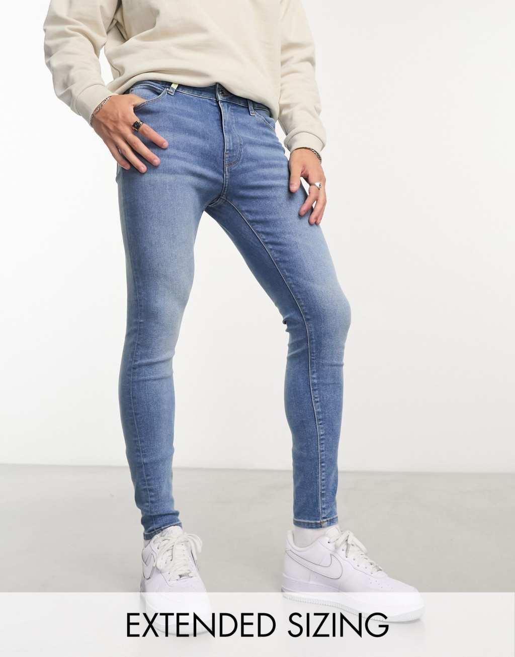ASOS DESIGN power stretch jeans in mid wash blue Product Image