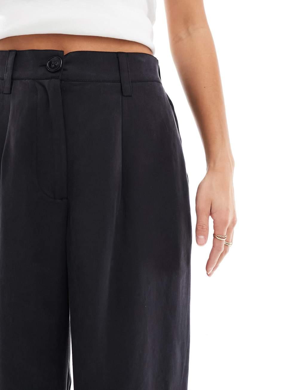 ASOS DESIGN Petite relaxed straight leg pants in washed black Product Image