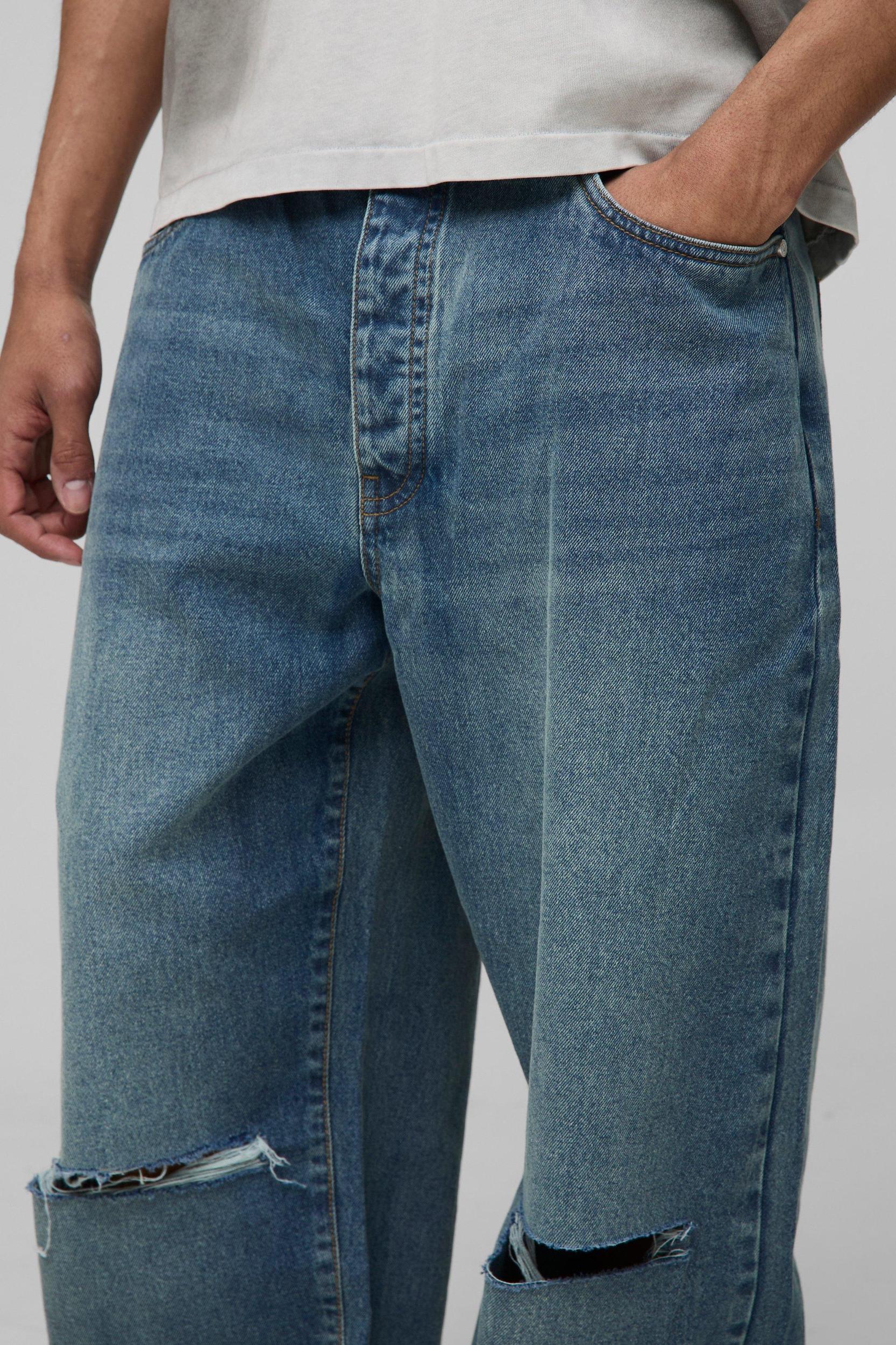 Wide Leg Ripped Knee Jeans With Let Down Hem | boohooMAN USA Product Image