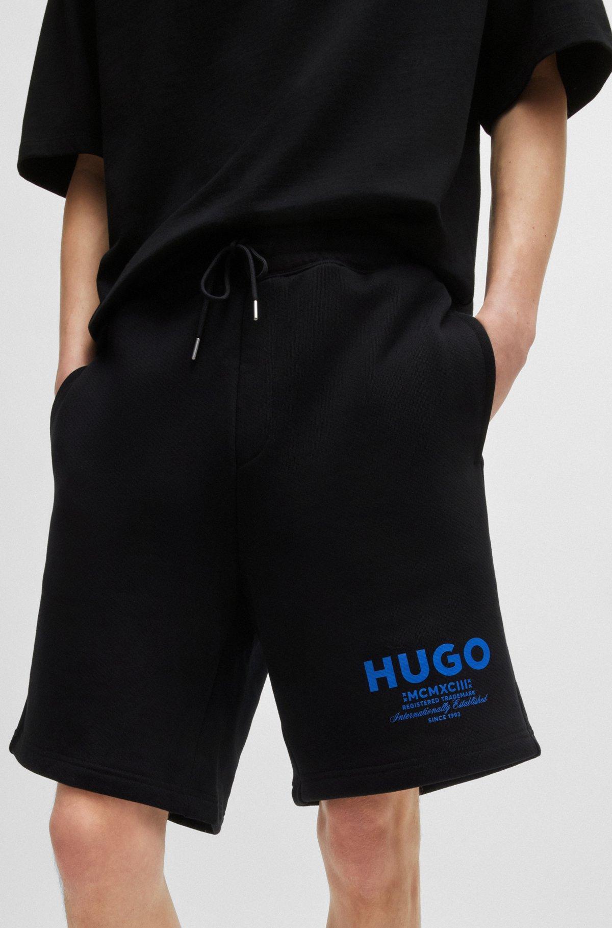 Loose-fit shorts in cotton terry with logo print Product Image