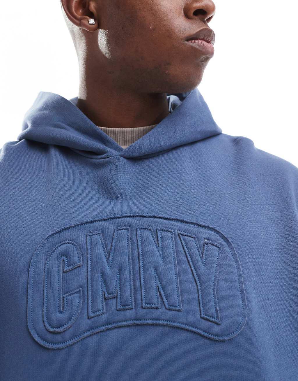 ASOS DESIGN boxy oversized hoodie with raw edge print in blue Product Image