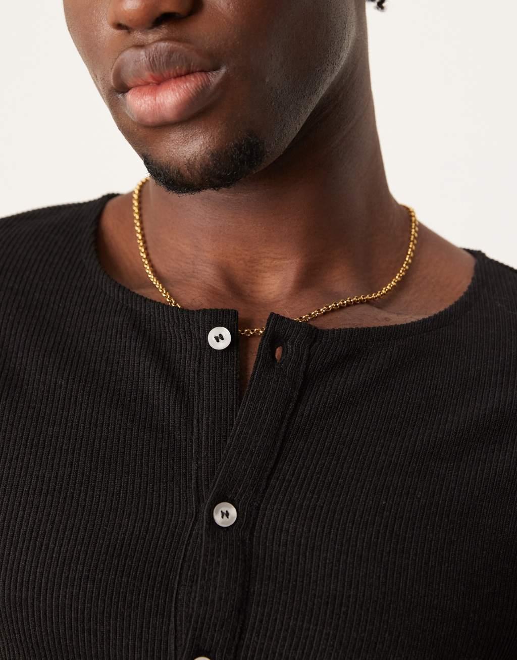 ASOS DESIGN muscle fit long sleeve boxy t-shirt with henley neck in black rib Product Image
