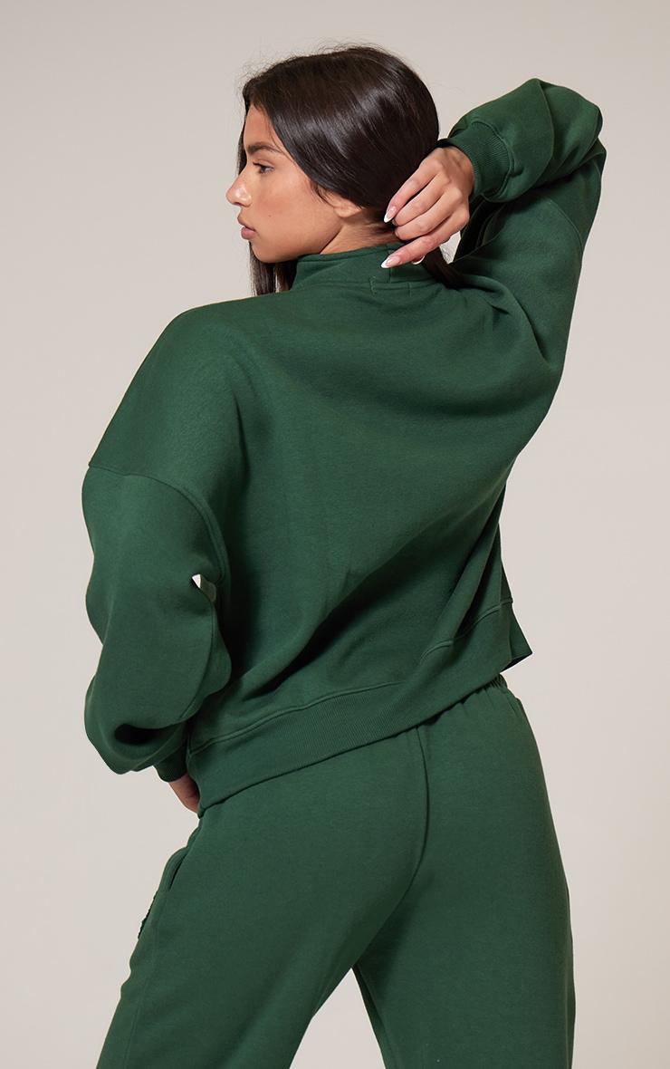 PRETTYLITTLETHING Forest Green Borg Applique Quarter Zip Sweatshirt Product Image