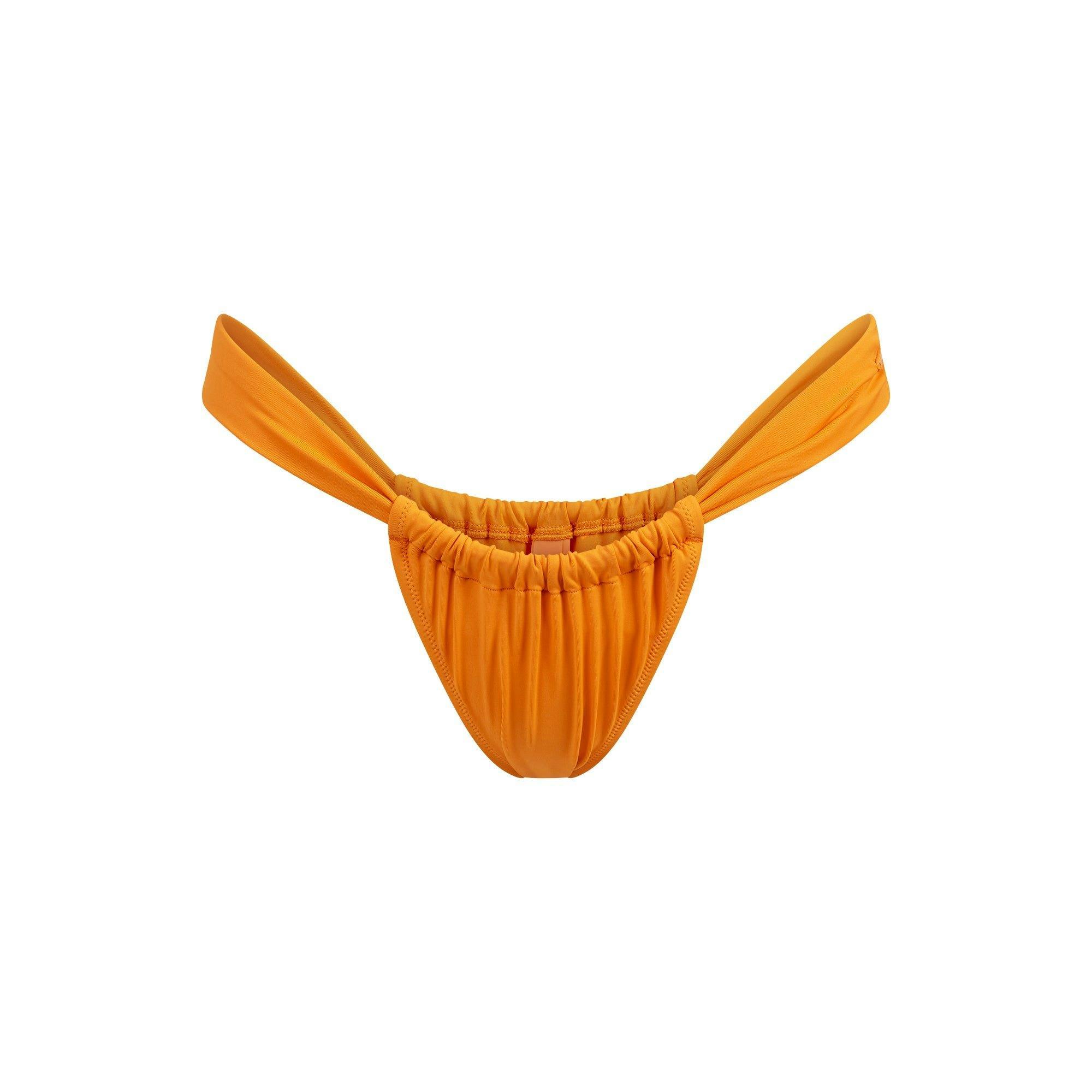 SIGNATURE SWIM RUCHED THONG BIKINI BOTTOM | TANGERINE Product Image