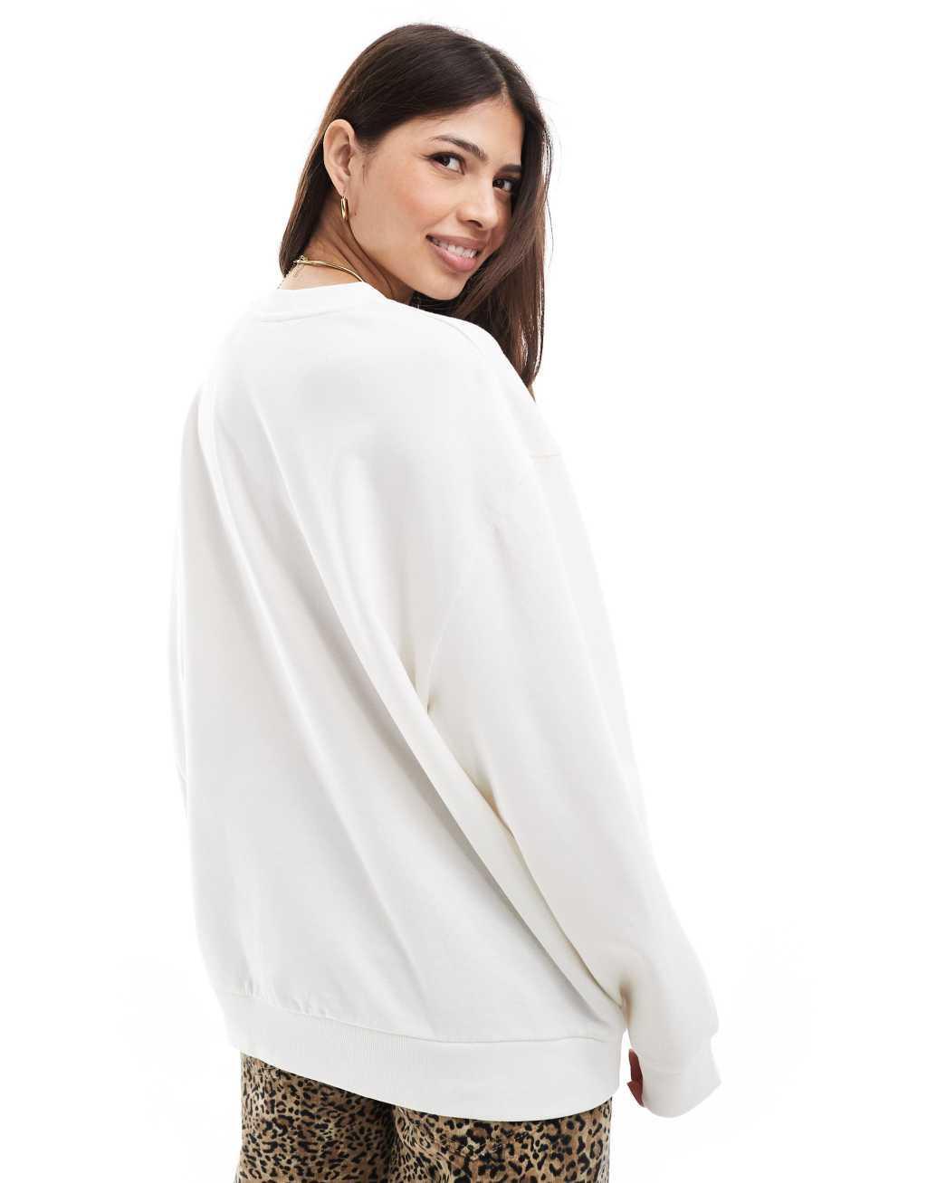 ASOS DESIGN sweatshirt with milan graphic in leopard in cream Product Image