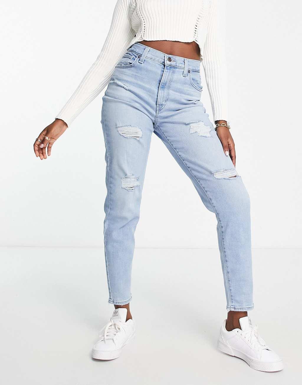 Levi's high waisted distressed mom jean in light wash blue Product Image
