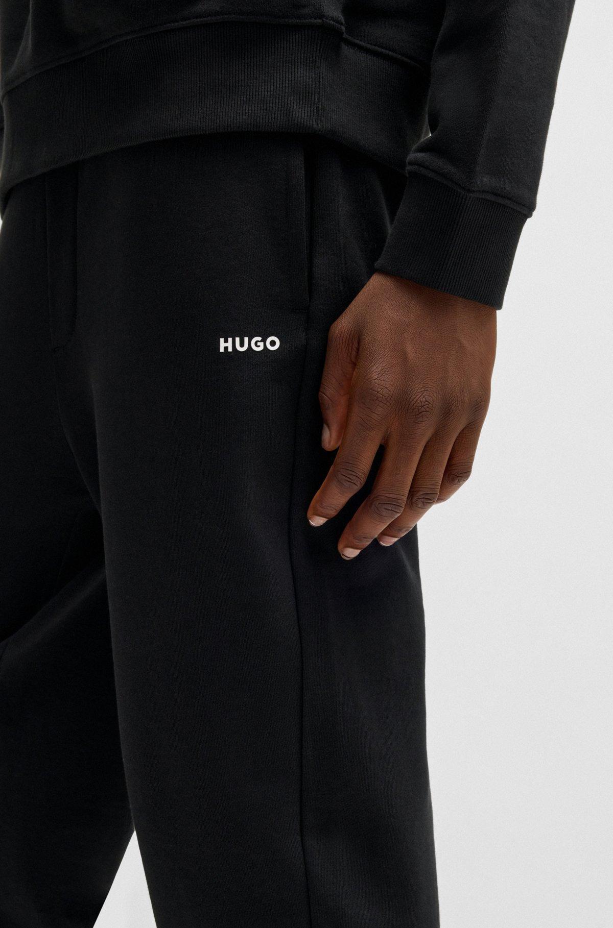 Cotton-terry tracksuit bottoms with logo print Product Image