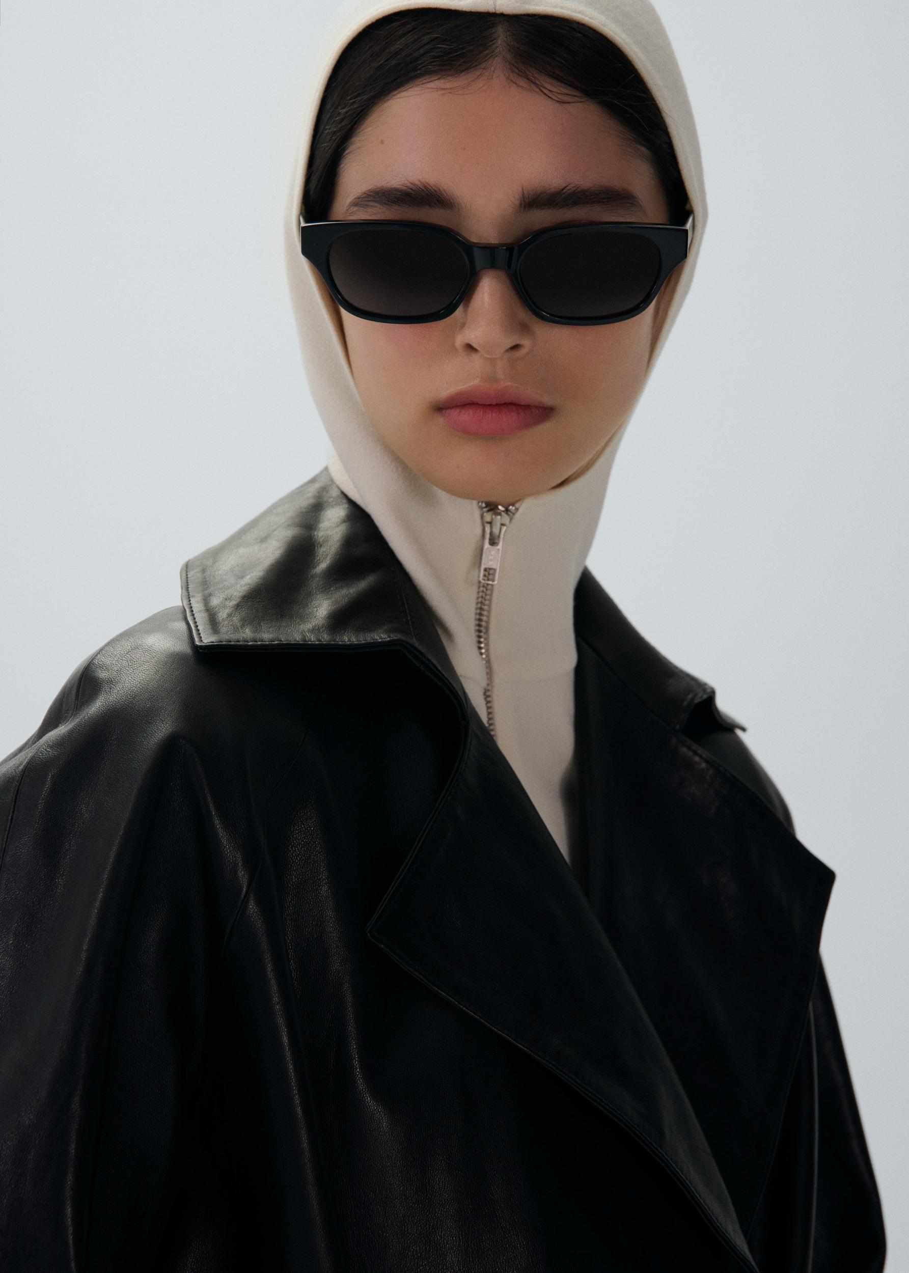 Belted leather wrap coat in black Product Image