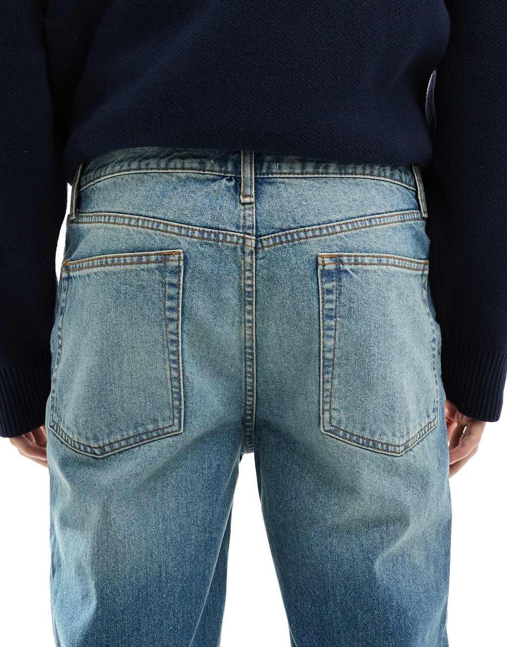 ASOS DESIGN straight leg jeans in tinted vintage light wash blue Product Image