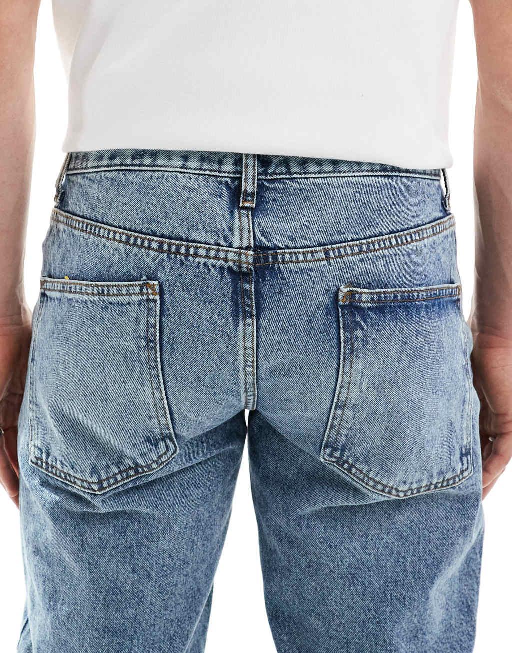 ASOS DESIGN tapered fit jeans in mid wash blue  Product Image