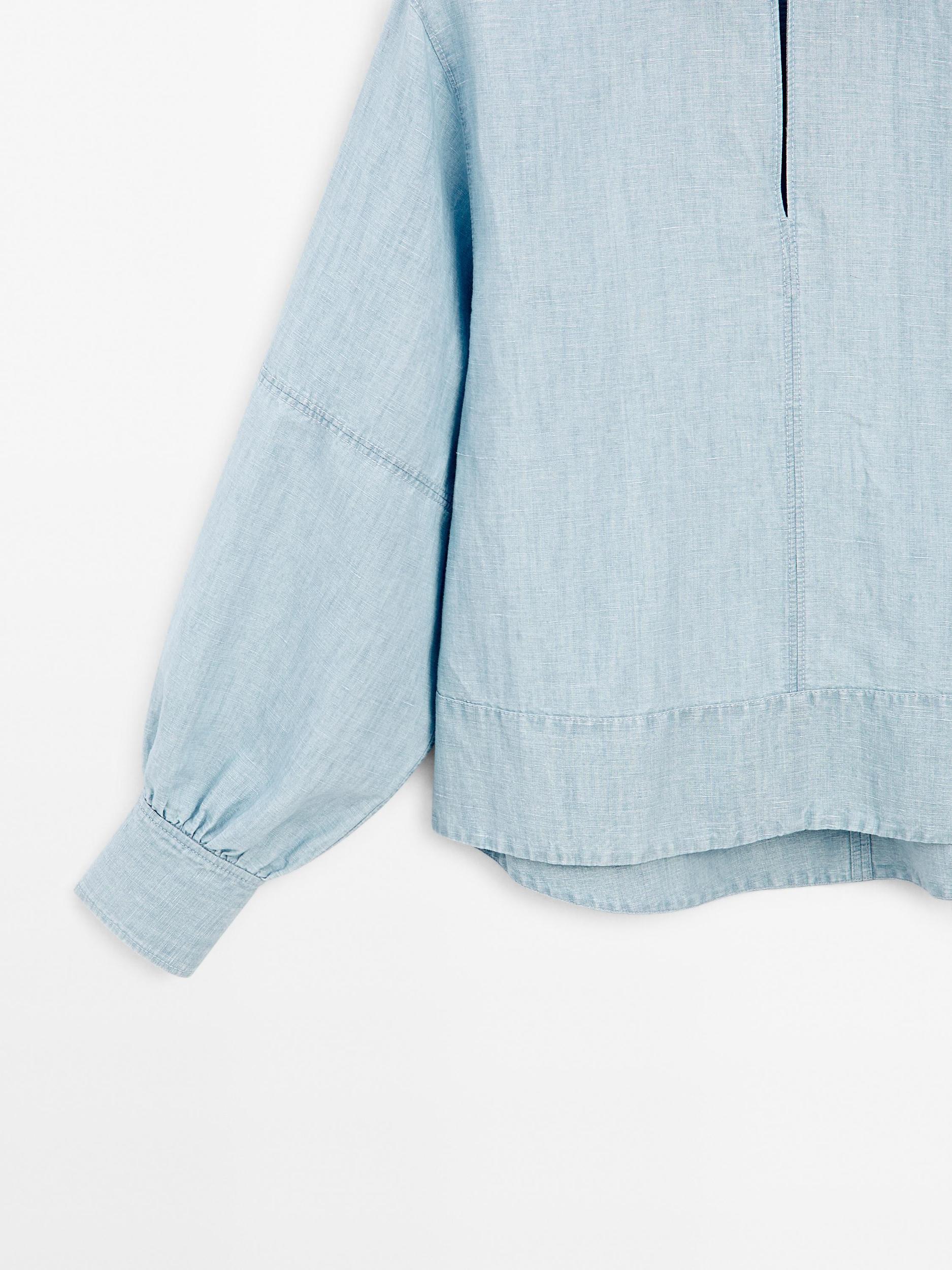 Oversize denim blouse with puff sleeves Product Image