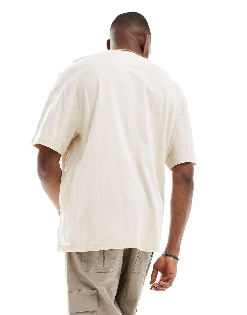 Tommy Jeans oversized signature T-shirt in off-white Product Image