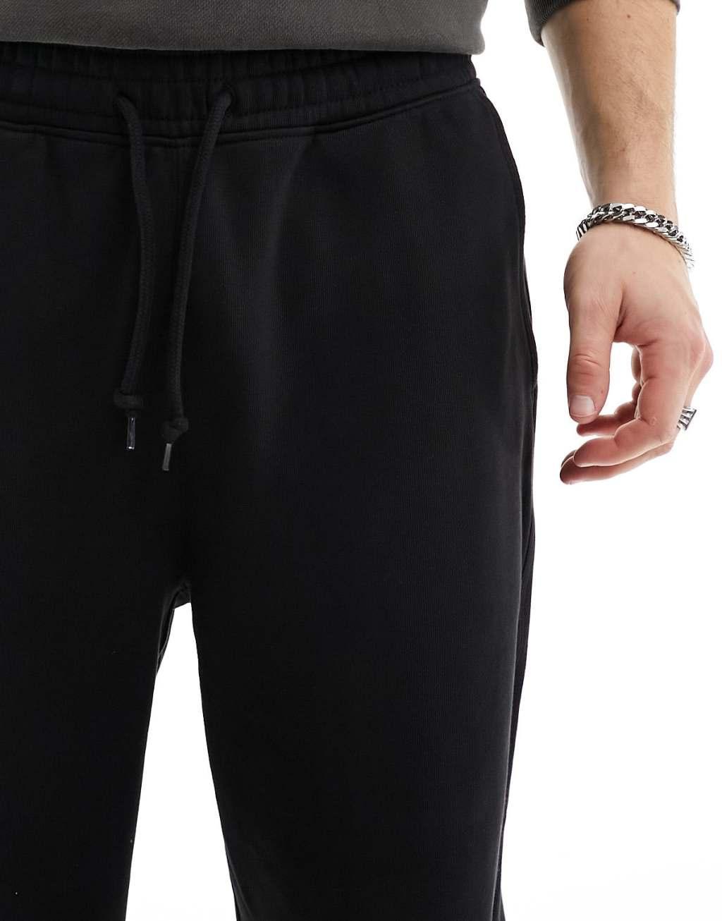 Weekday Astro loose fit sweatpants in black Product Image