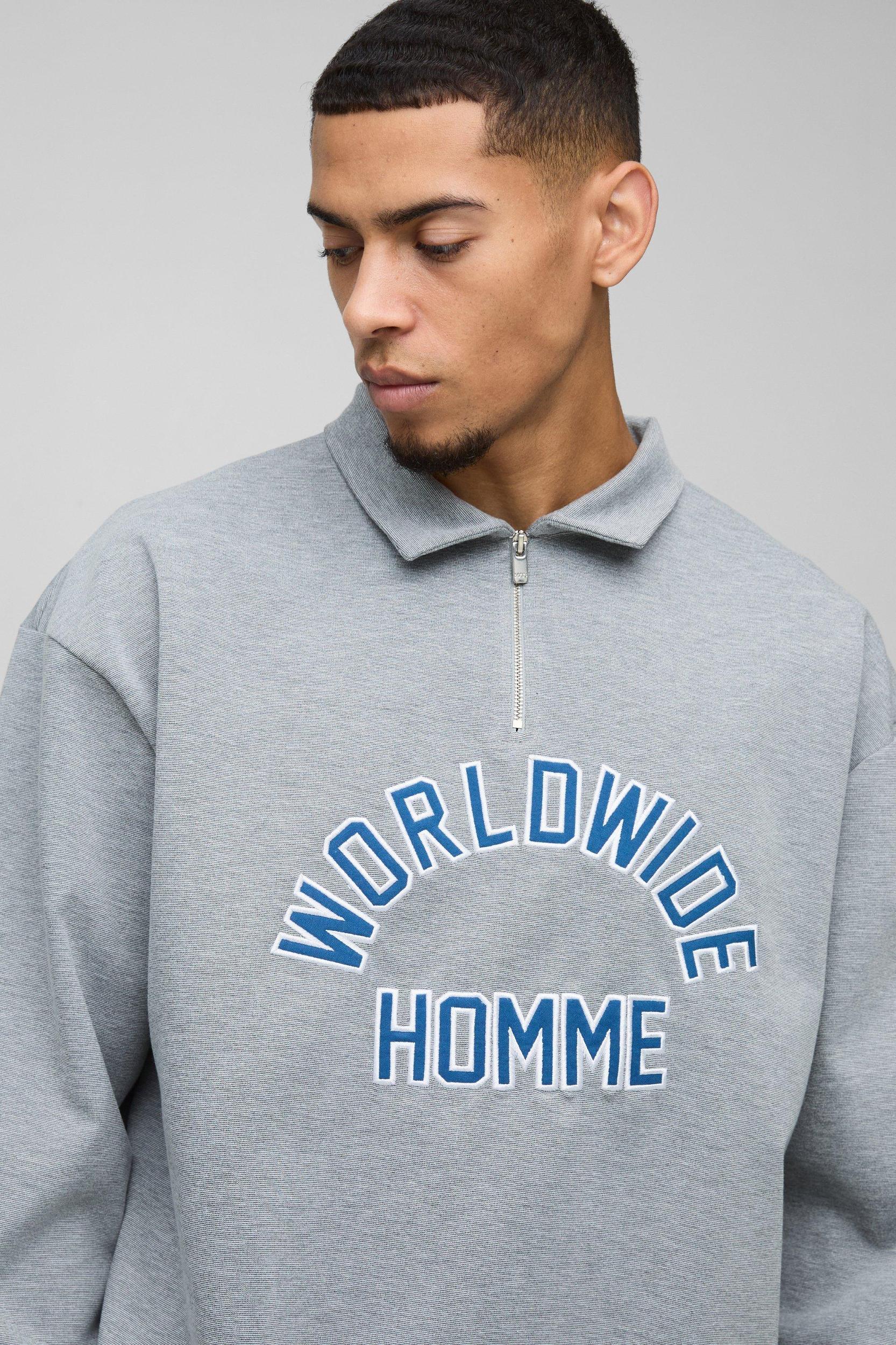 Oversized Worldwide Applique Half Zip Rugby Polo | boohooMAN USA Product Image