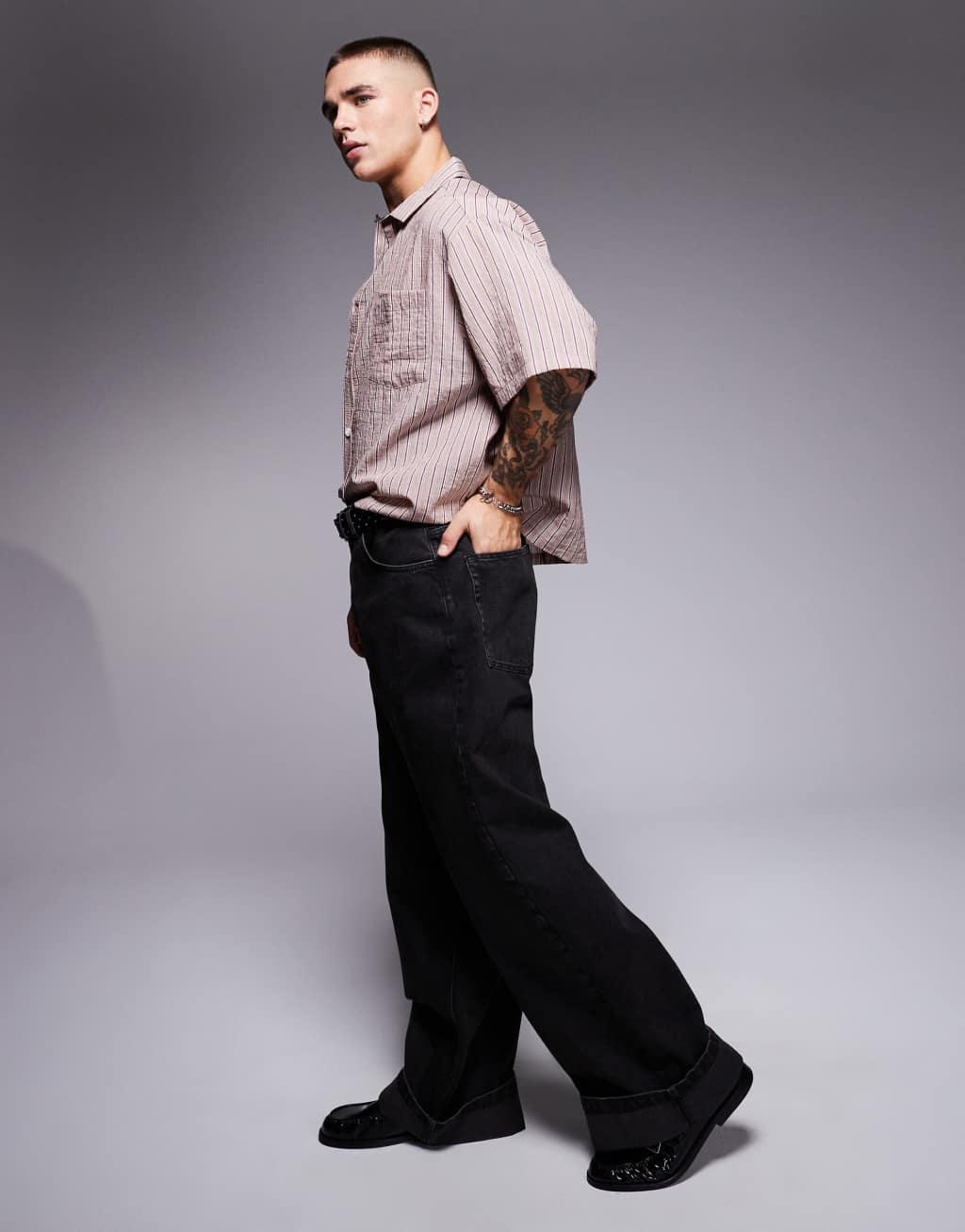 ASOS DESIGN super baggy jeans with cuffed hems in washed black Product Image