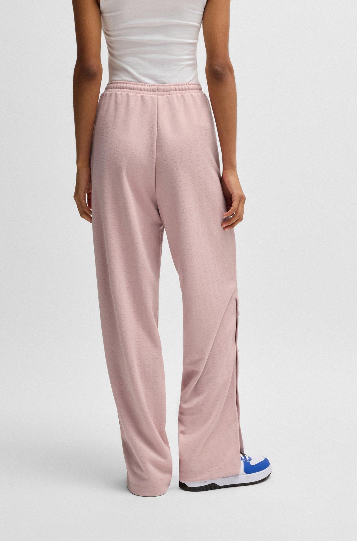 HUGO - Oversize-fit tracksuit bottoms with logo jacquard - Patterned Product Image