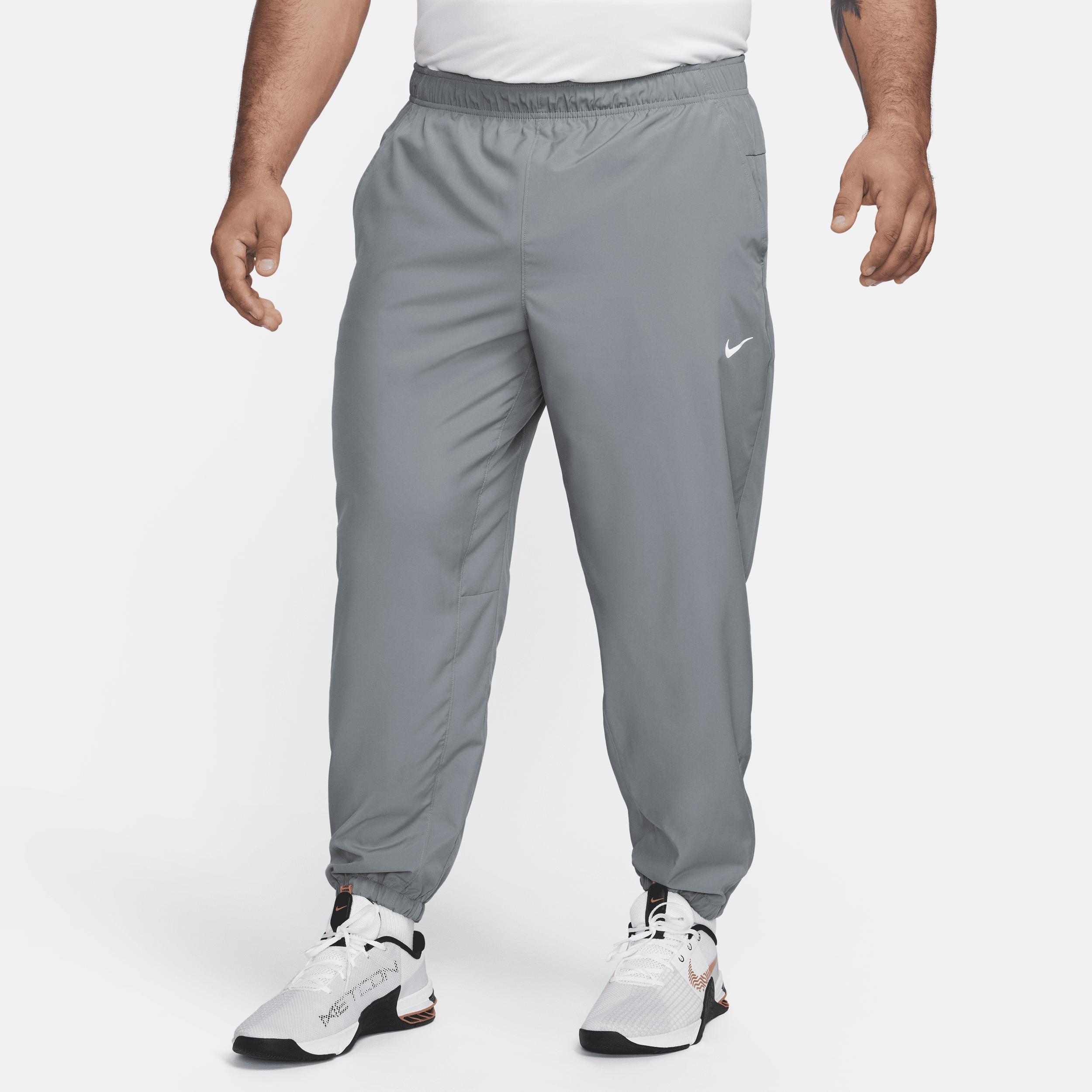Nike Men's Form Dri-FIT Tapered Versatile Pants in Grey/Smoke Grey Size Large 100% Polyester Product Image