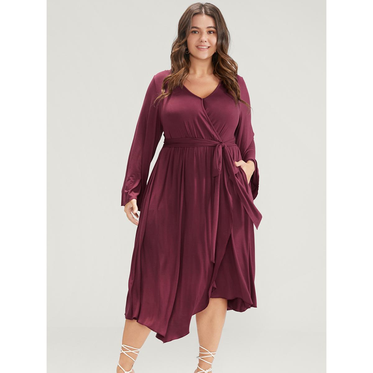 Plus Size Solid Wrap Knotted Front Pocket Bell Sleeve Asymmetrical Hem Dress Burgundy Women Elegant Wrap V-neck Long Sleeve Curvy Midi Dress BloomChic 12/L Product Image