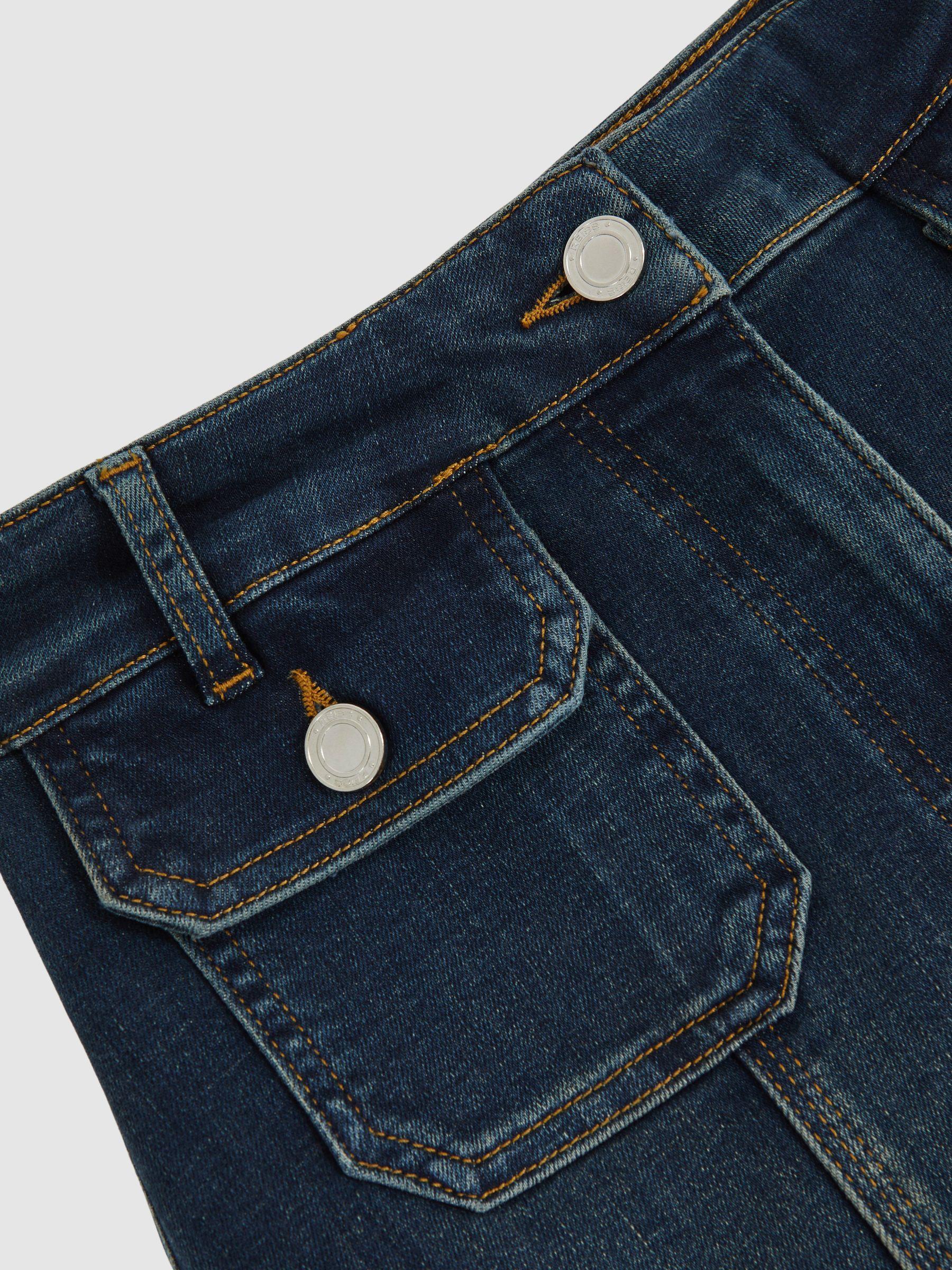 Petite Button-Pocket Flared Jeans in Mid Blue Product Image