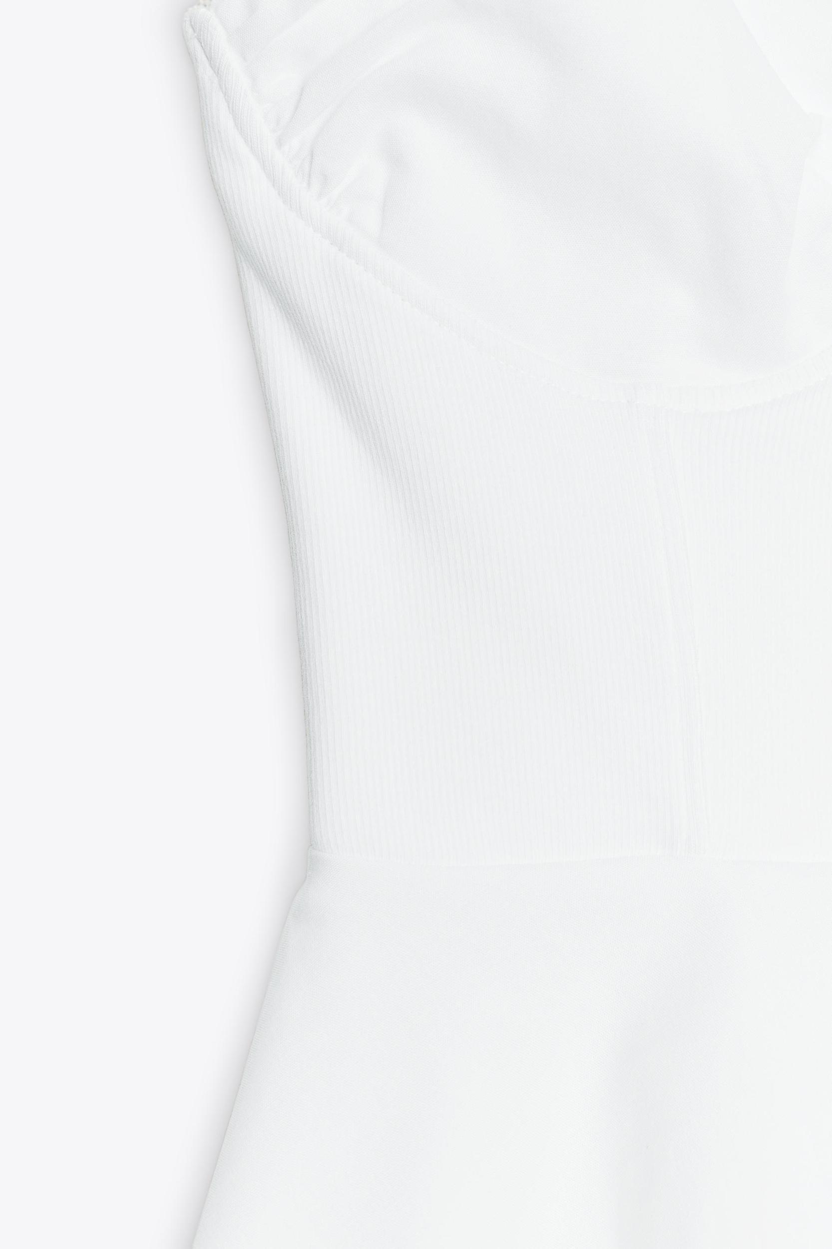 PEPLUM MIXED TOP Product Image