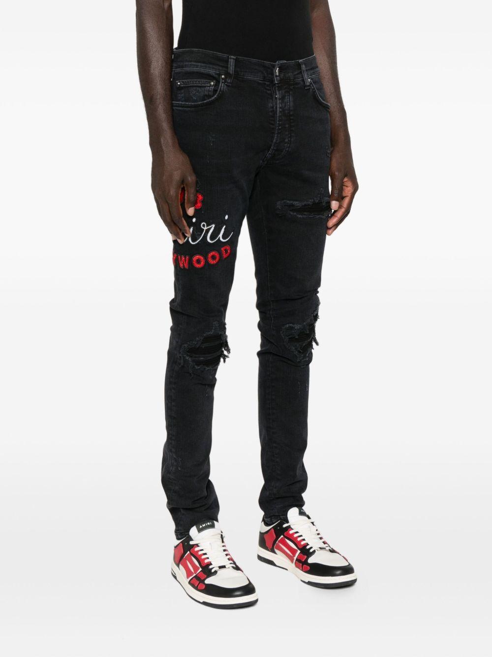 embroidered distressed jeans Product Image