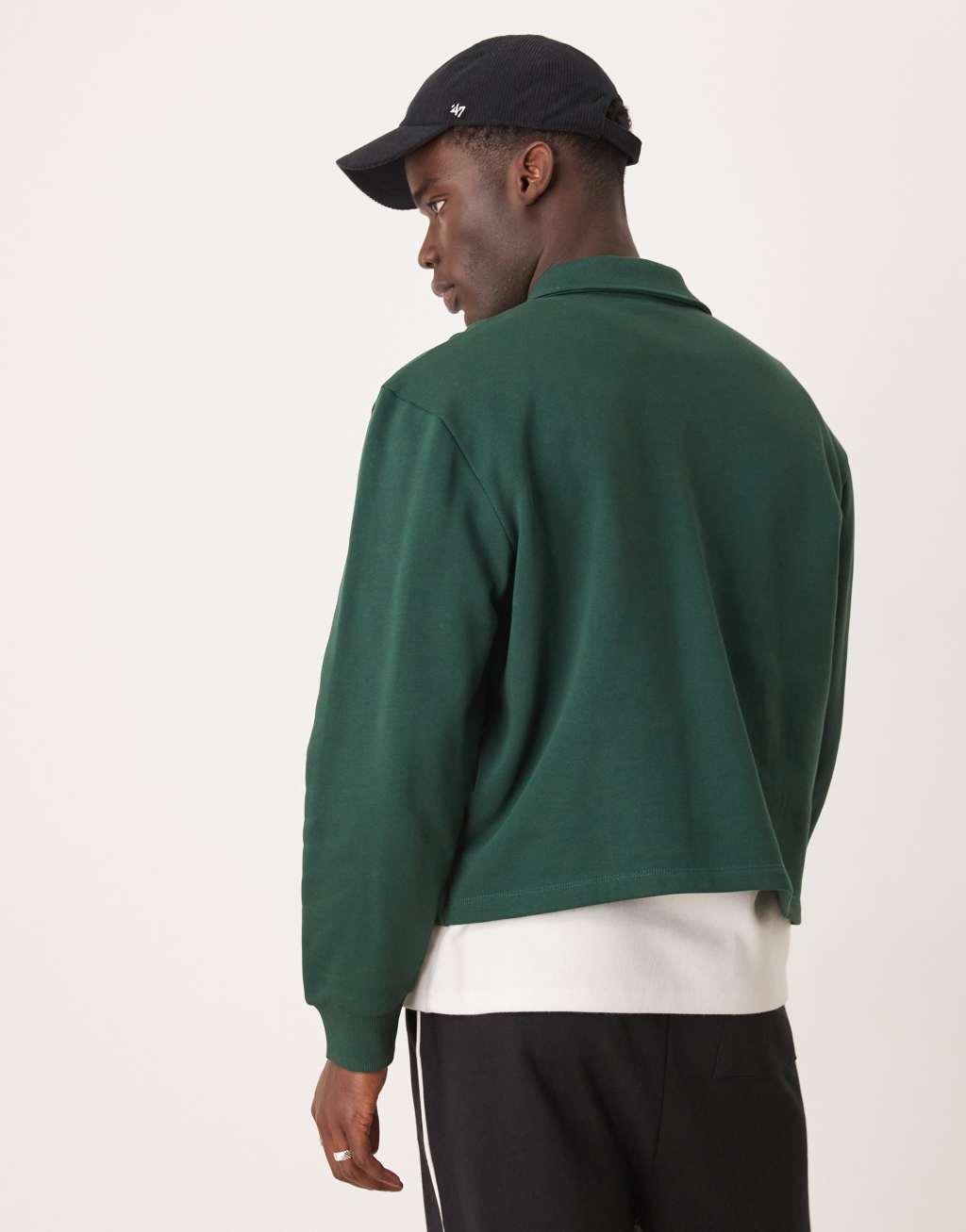 ASOS DESIGN boxy oversized polo shirt with tipping and embroidered chest print in green Product Image