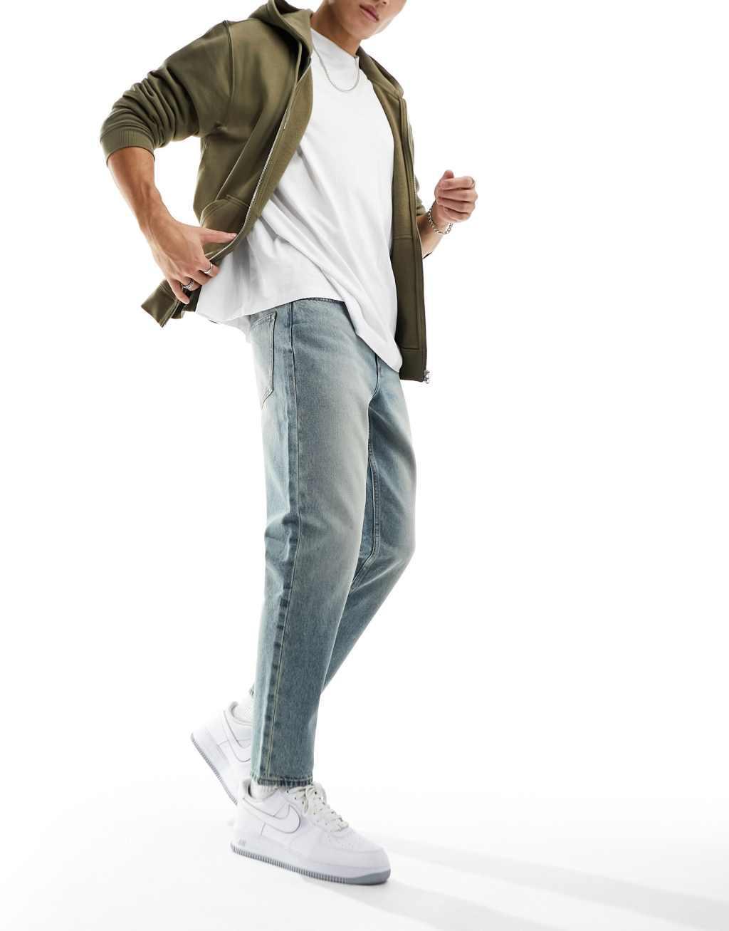 ASOS DESIGN tapered fit jeans in vintage light blue wash  Product Image