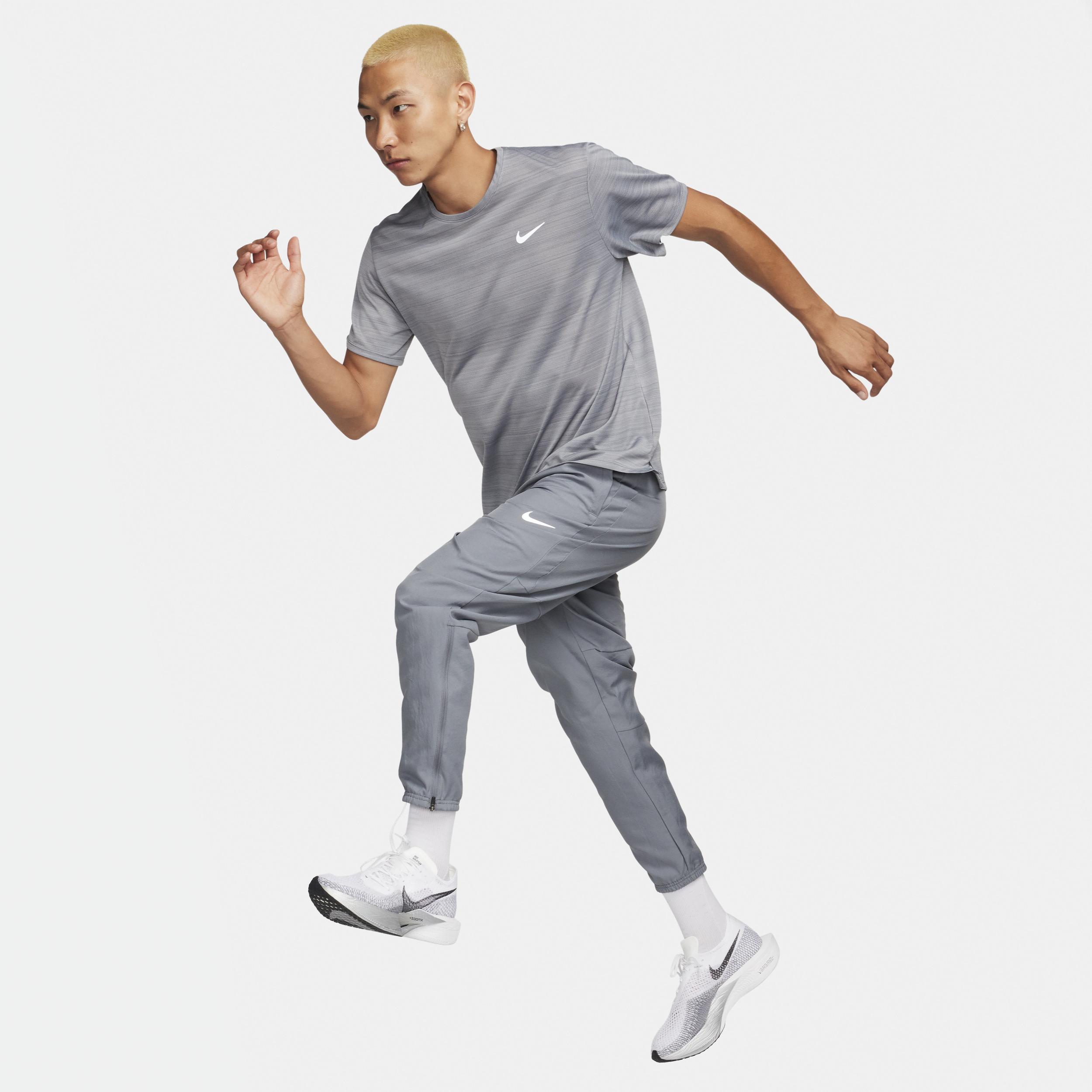 Nike Men's Challenger Dri-FIT Woven Running Pants in Grey/Smoke Grey Size Medium Polyester Product Image
