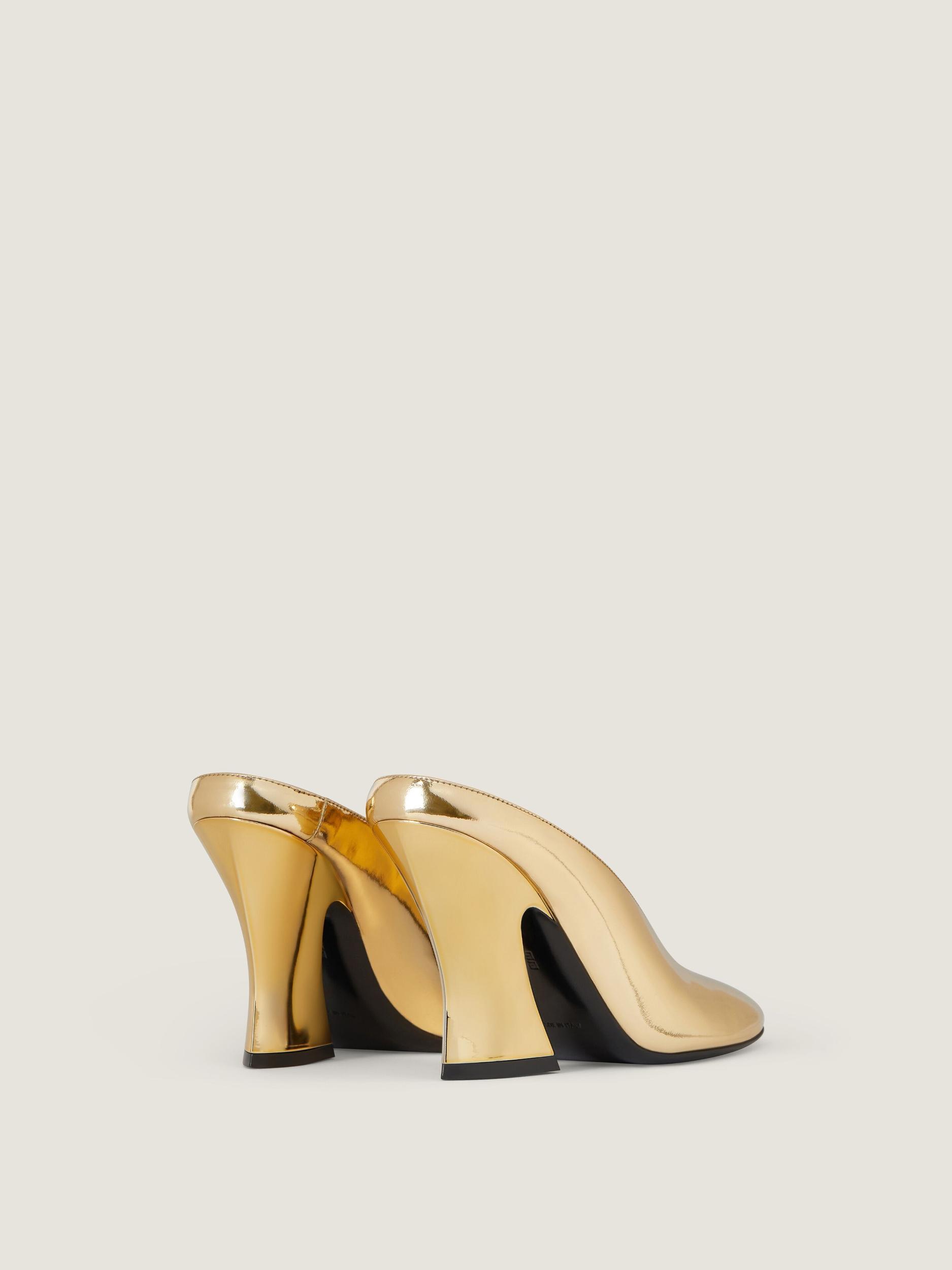 Sculpted heeled mules in mirror effect leather Product Image