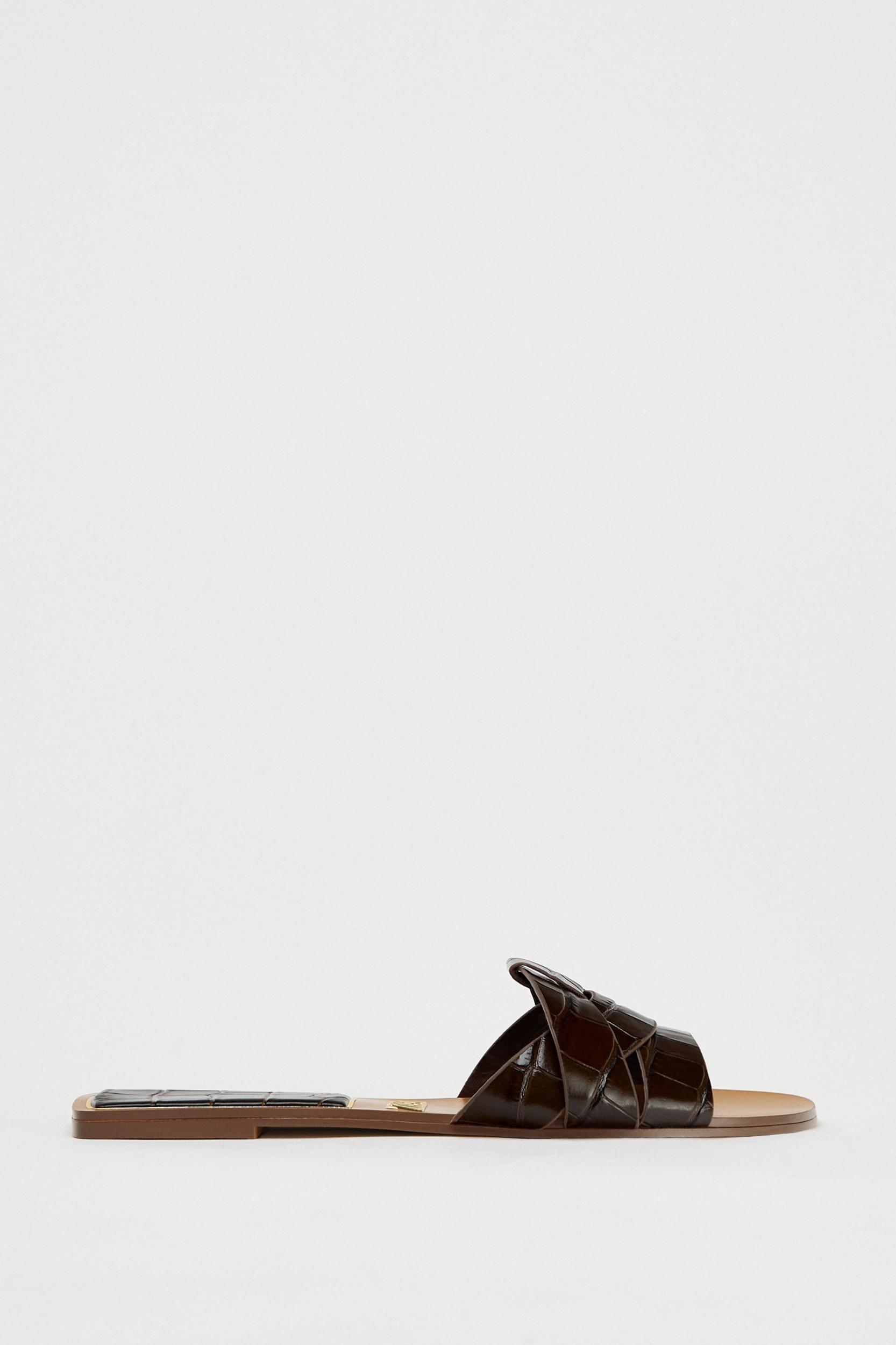 EMBOSSED LEATHER FLAT SANDALS Product Image