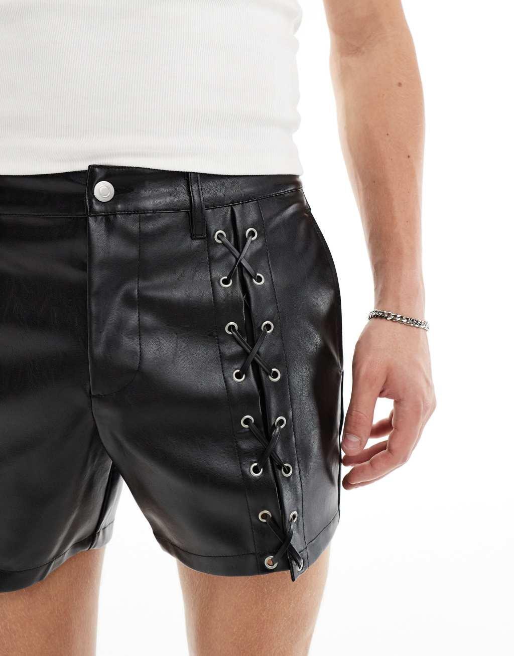 ASOS DESIGN slim leather look shorts with lace up details in black Product Image