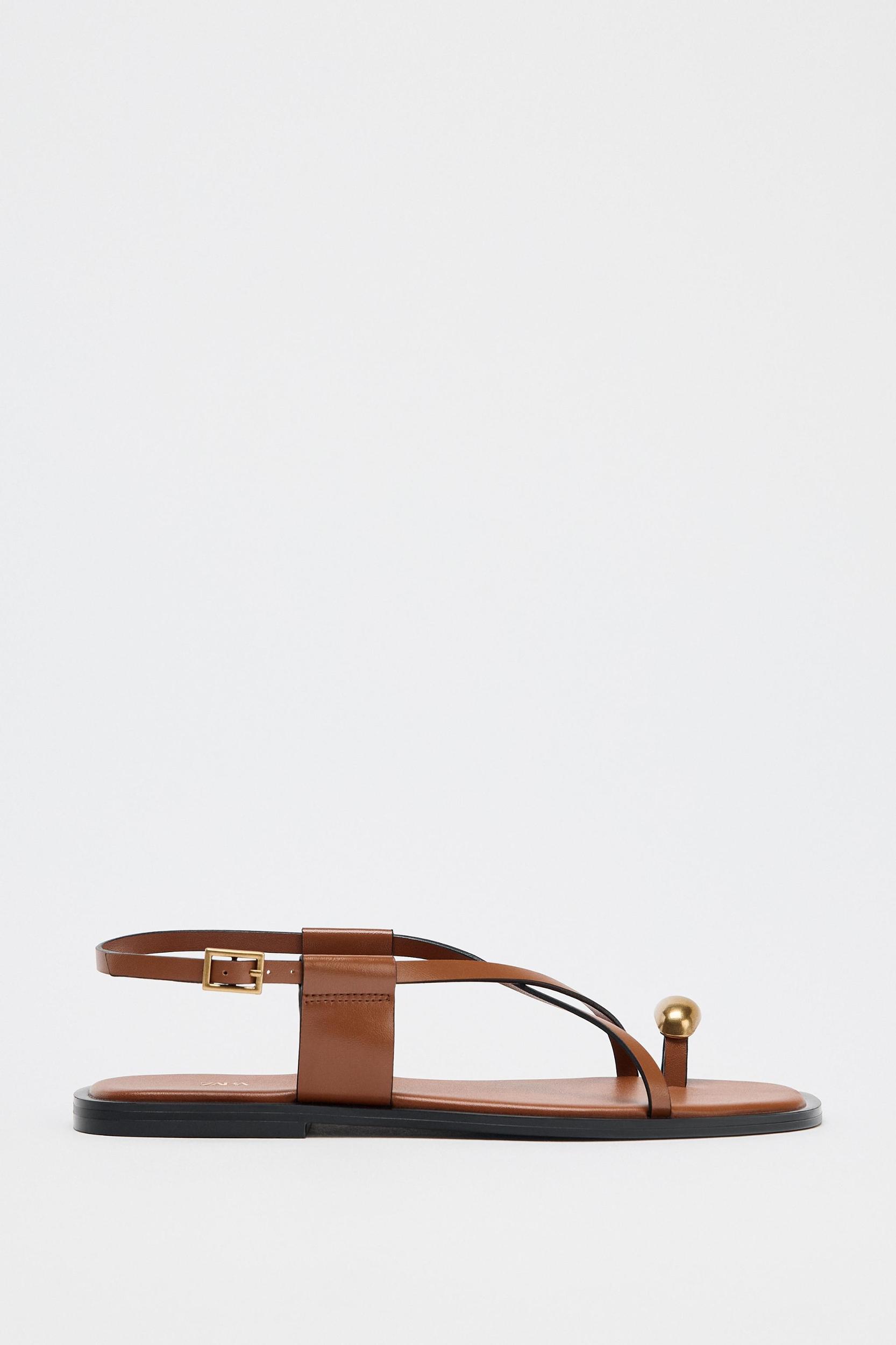 FLAT SANDALS WITH STRAPS AND METAL DETAIL Product Image