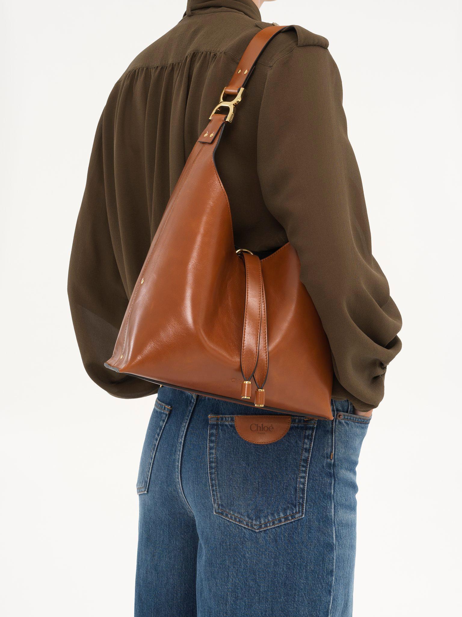 Small Marcie hobo bag in shiny leather Product Image
