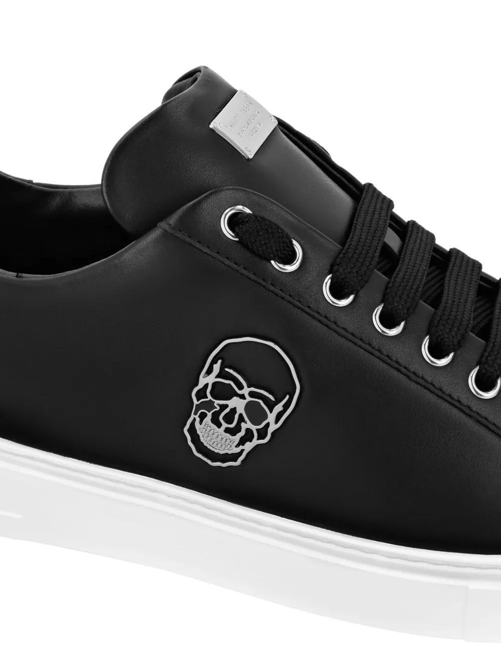 Skull-appliqué leather sneakers Product Image