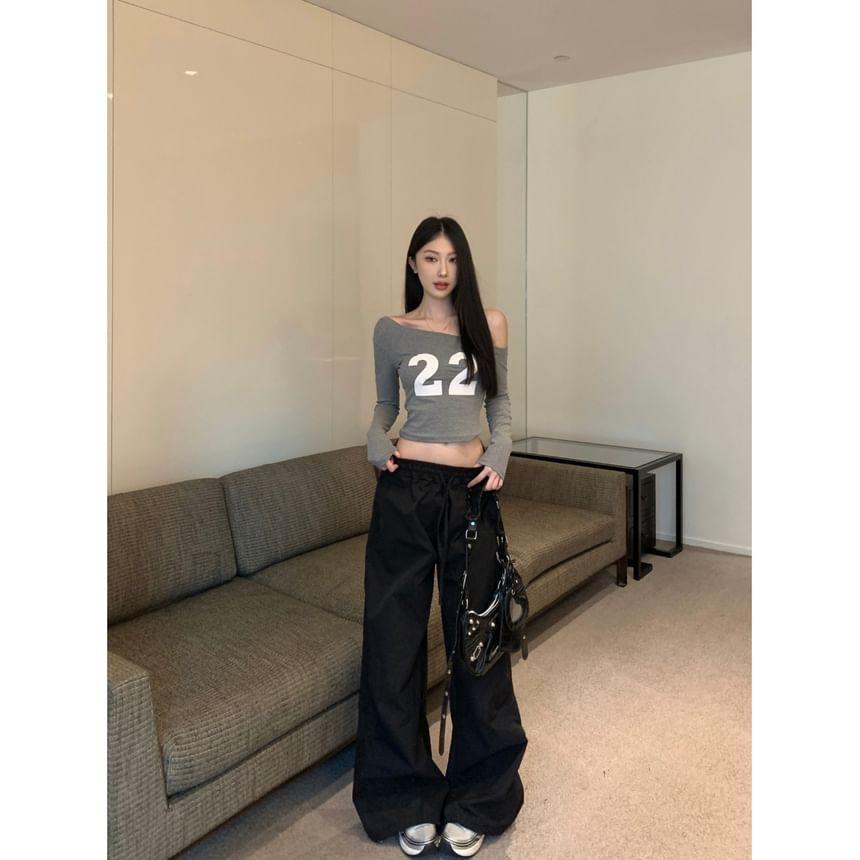 Off Shoulder Long-Sleeve Numbering Printed Cropped Tee / Mid Rise Plain Wide Leg Pants Product Image