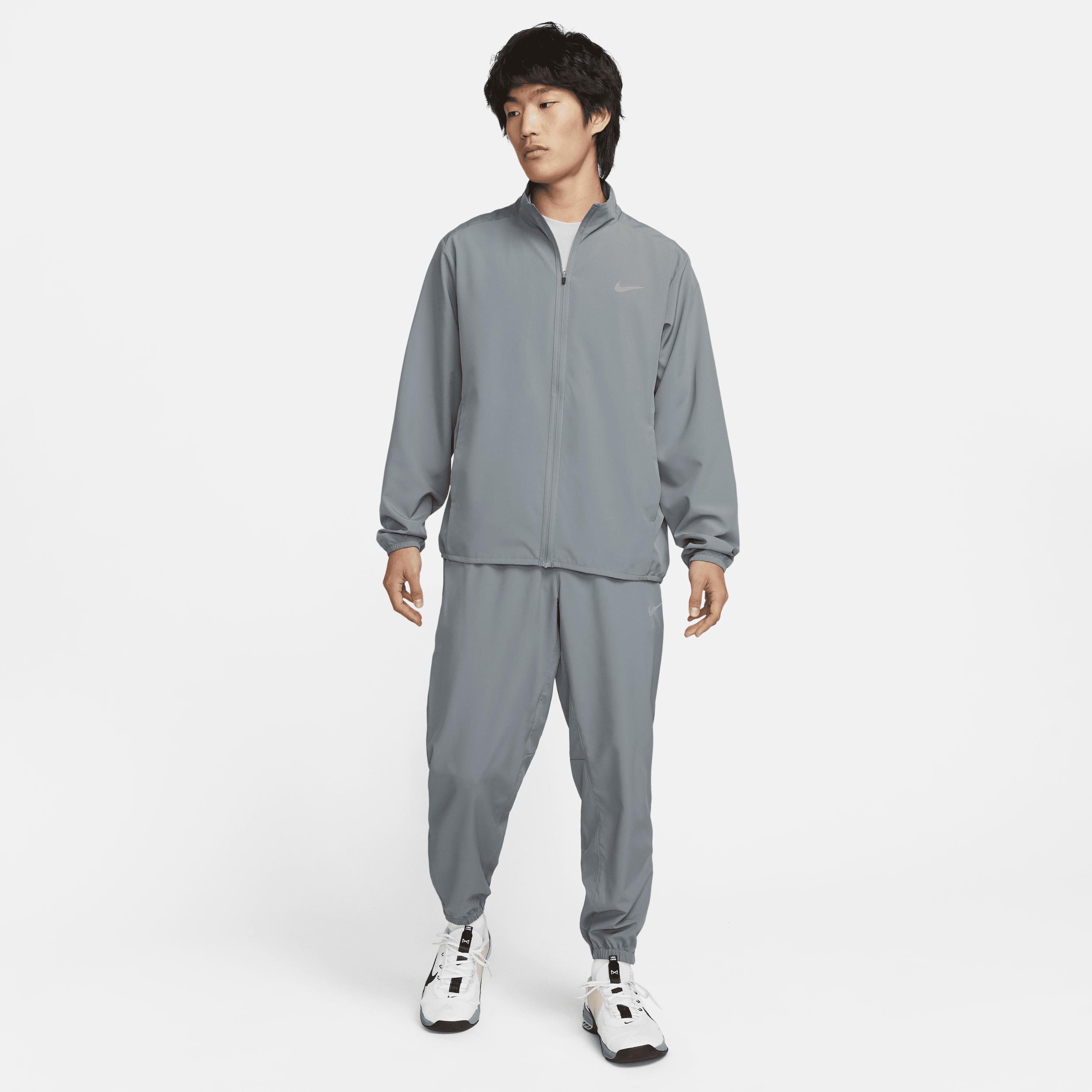 Nike Men's Form Dri-FIT Tapered Versatile Pants in Grey/Smoke Grey Size Large 100% Polyester Product Image