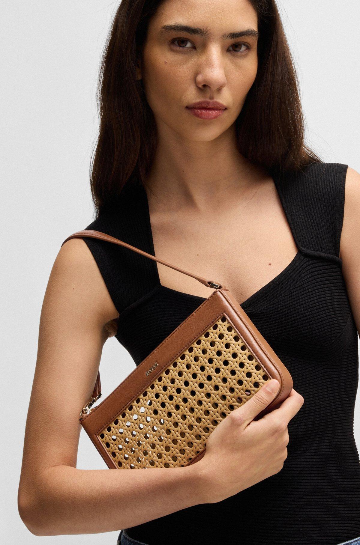 Woven shoulder bag with partially detachable handle Product Image
