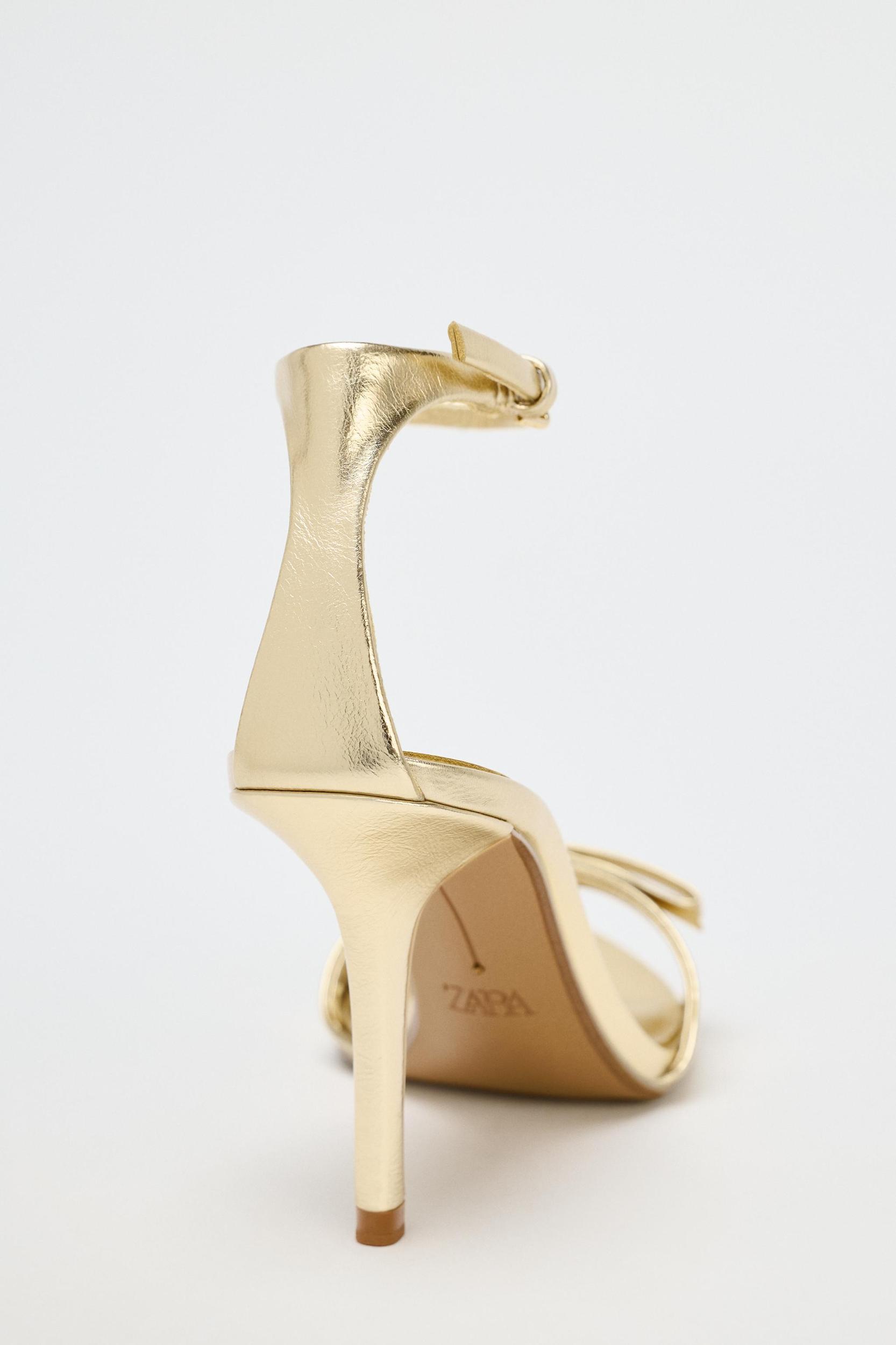 METALLIC EFFECT BOW HEELED SANDALS Product Image