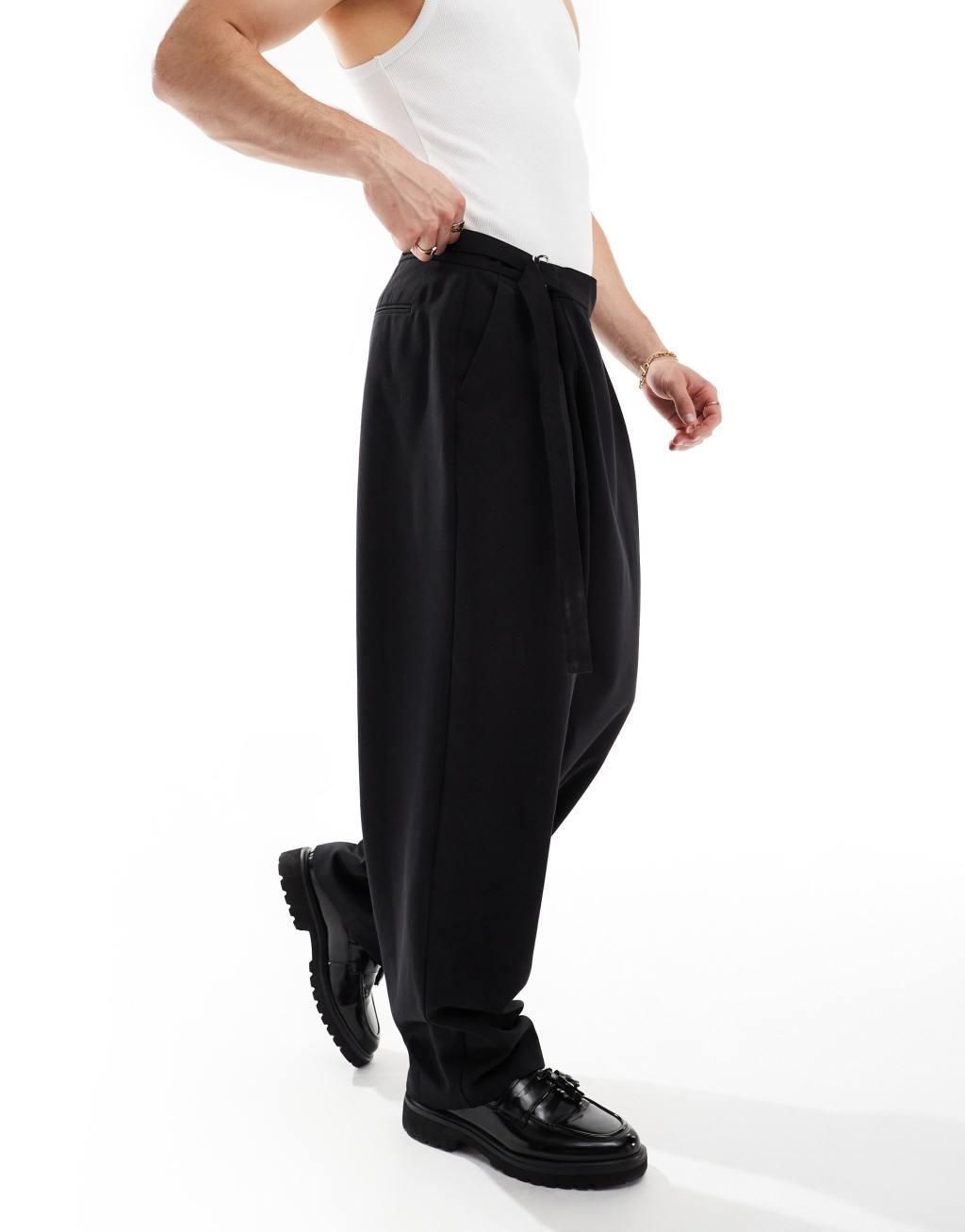 ASOS DESIGN wide leg dress pants with crossover side belt in black Product Image
