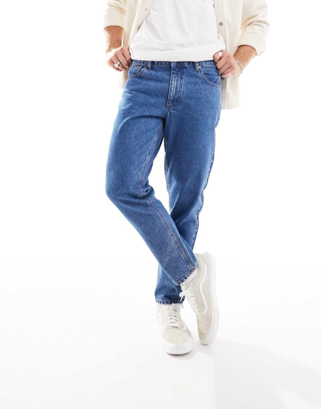 ASOS DESIGN tapered fit jeans in mid wash blue  Product Image