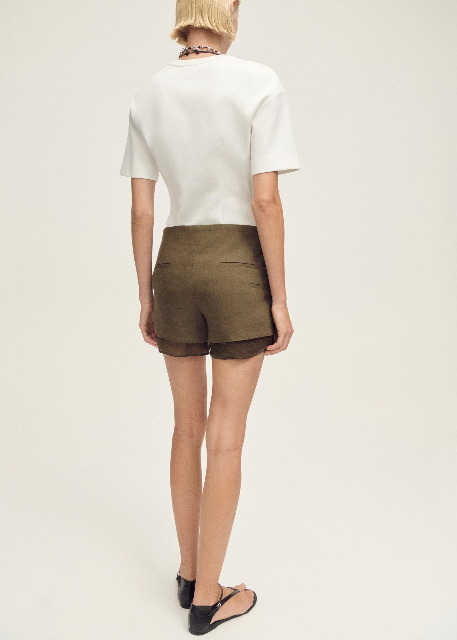 Short-sleeved peplum t-shirt - Women | MANGO USA Product Image