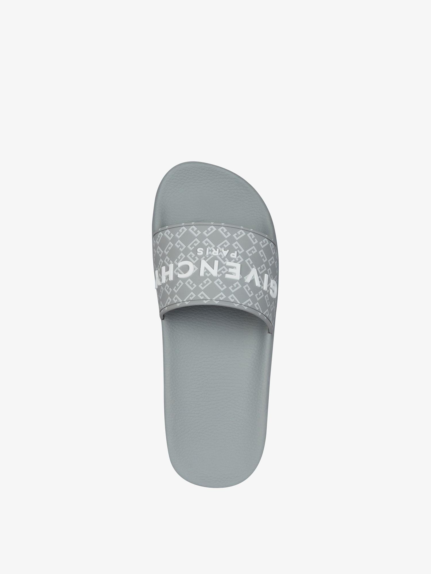 Slide flat sandals in monogram 72 rubber Product Image