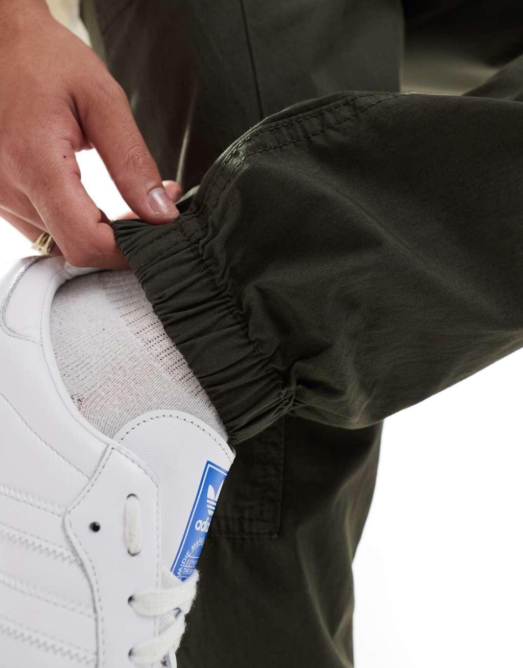ASOS DESIGN pull on cargo sweatpants in khaki with elastic waist Product Image