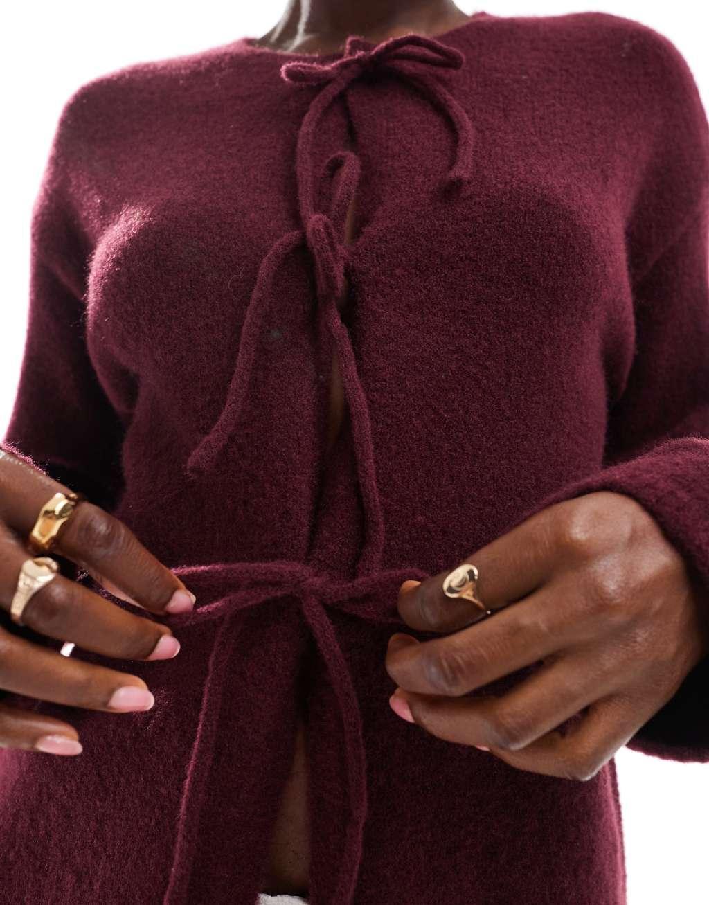 Monki knit bow tie up cardigan in burgundy Product Image