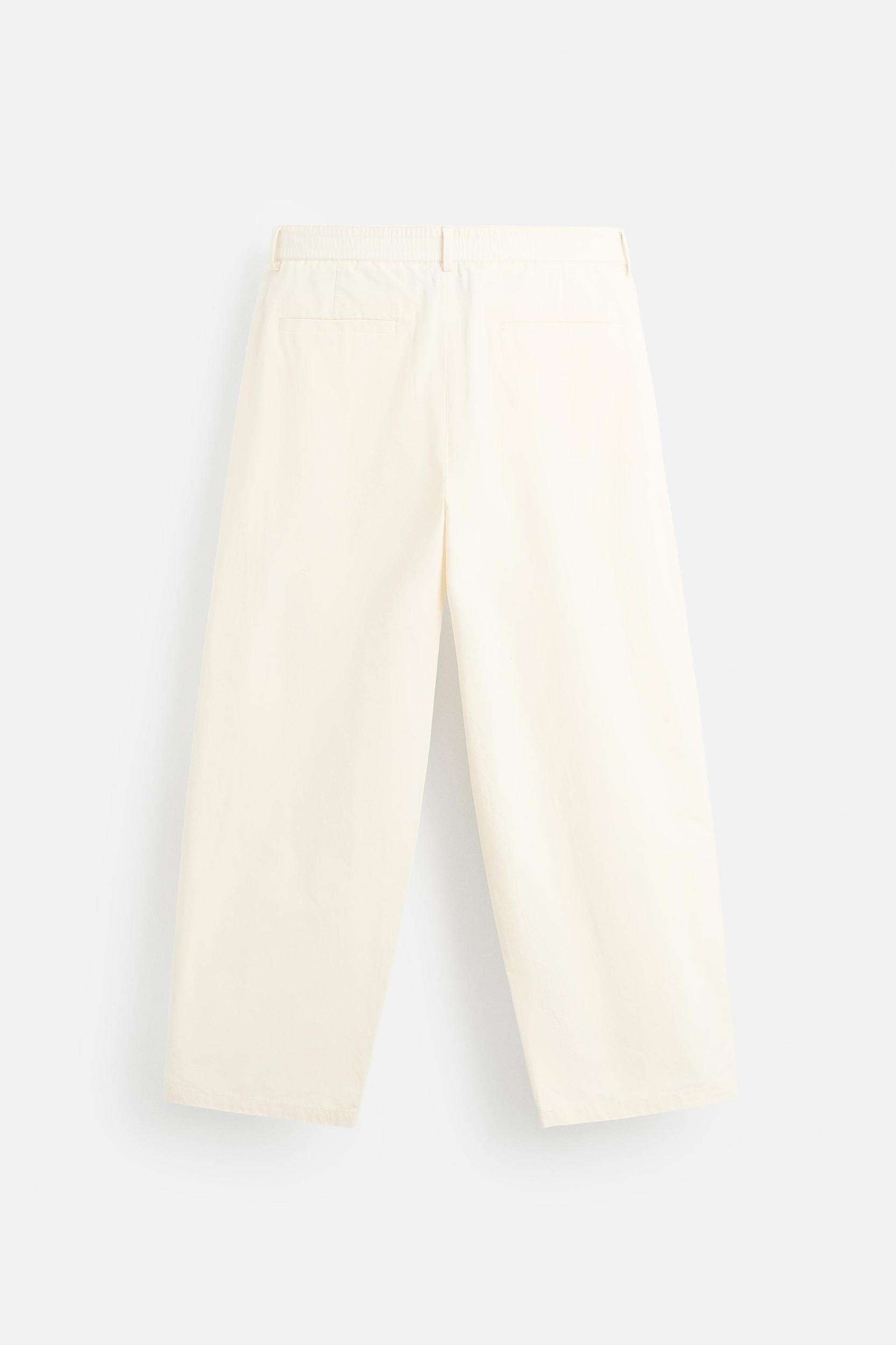 PLEATED CHINO PANTS Product Image