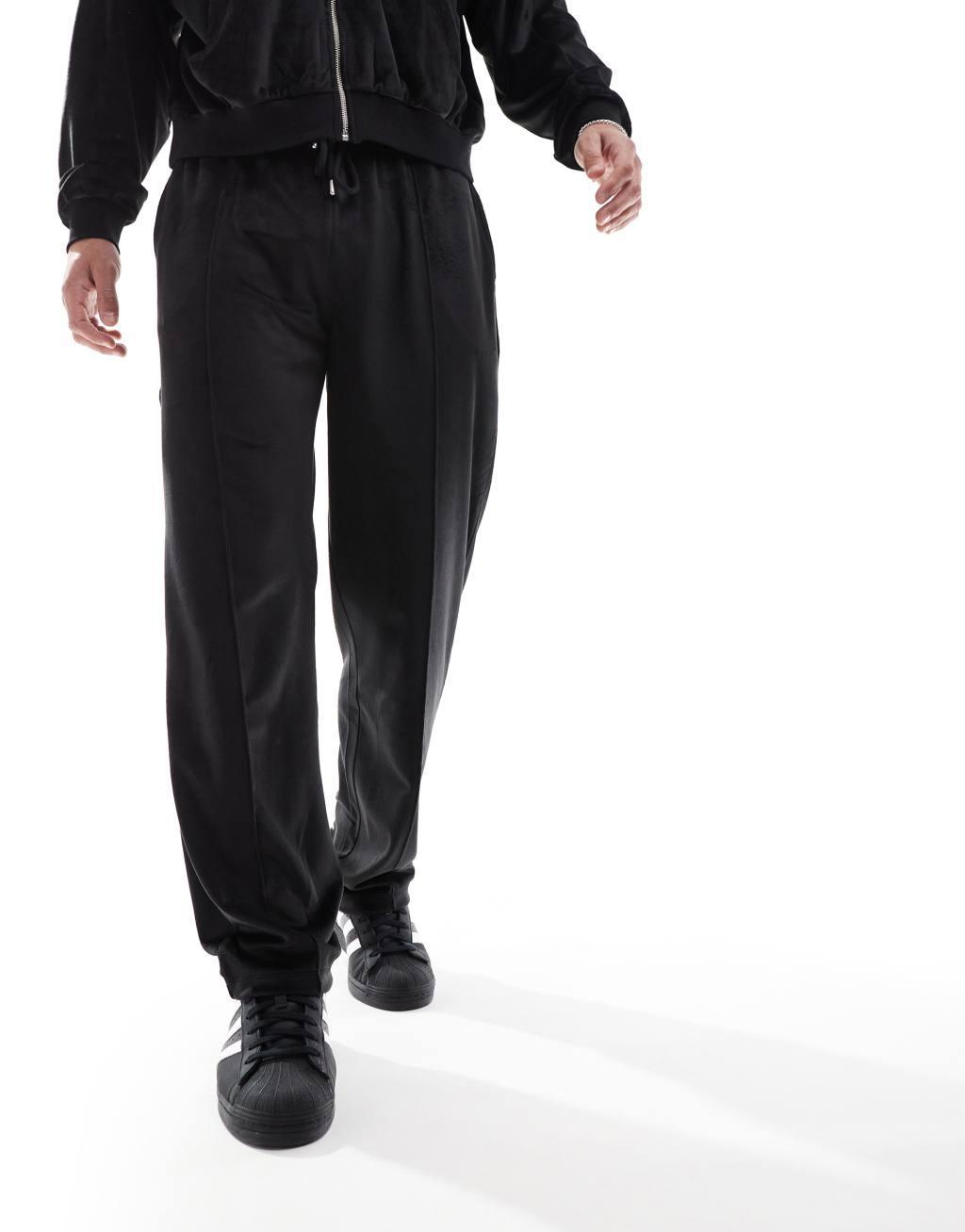 ASOS DESIGN straight leg velour sweatpants in black Product Image