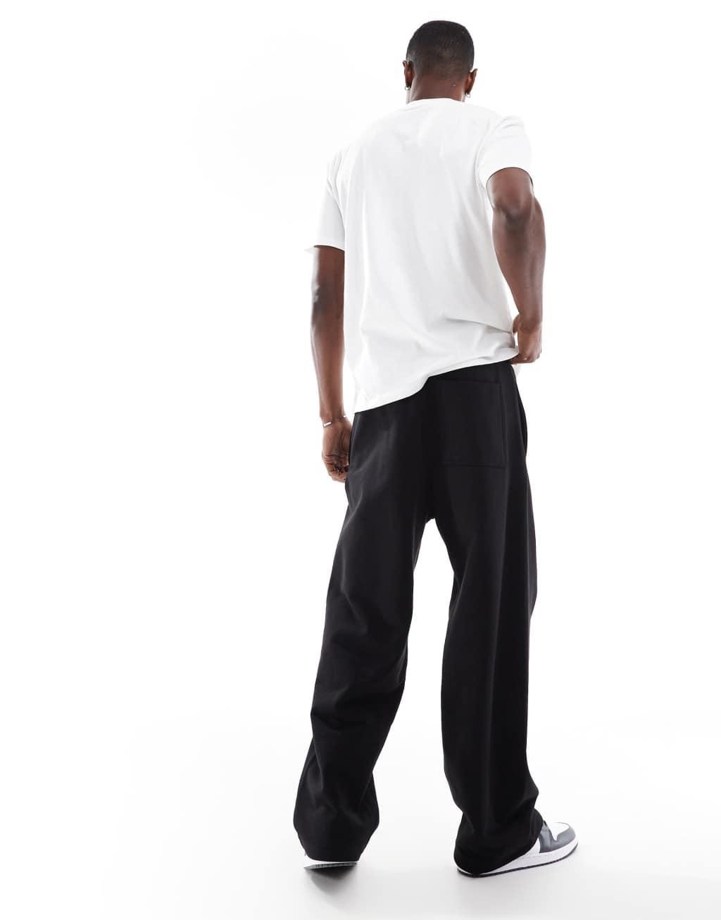 Pull&Bear baggy sweatpants in black Product Image